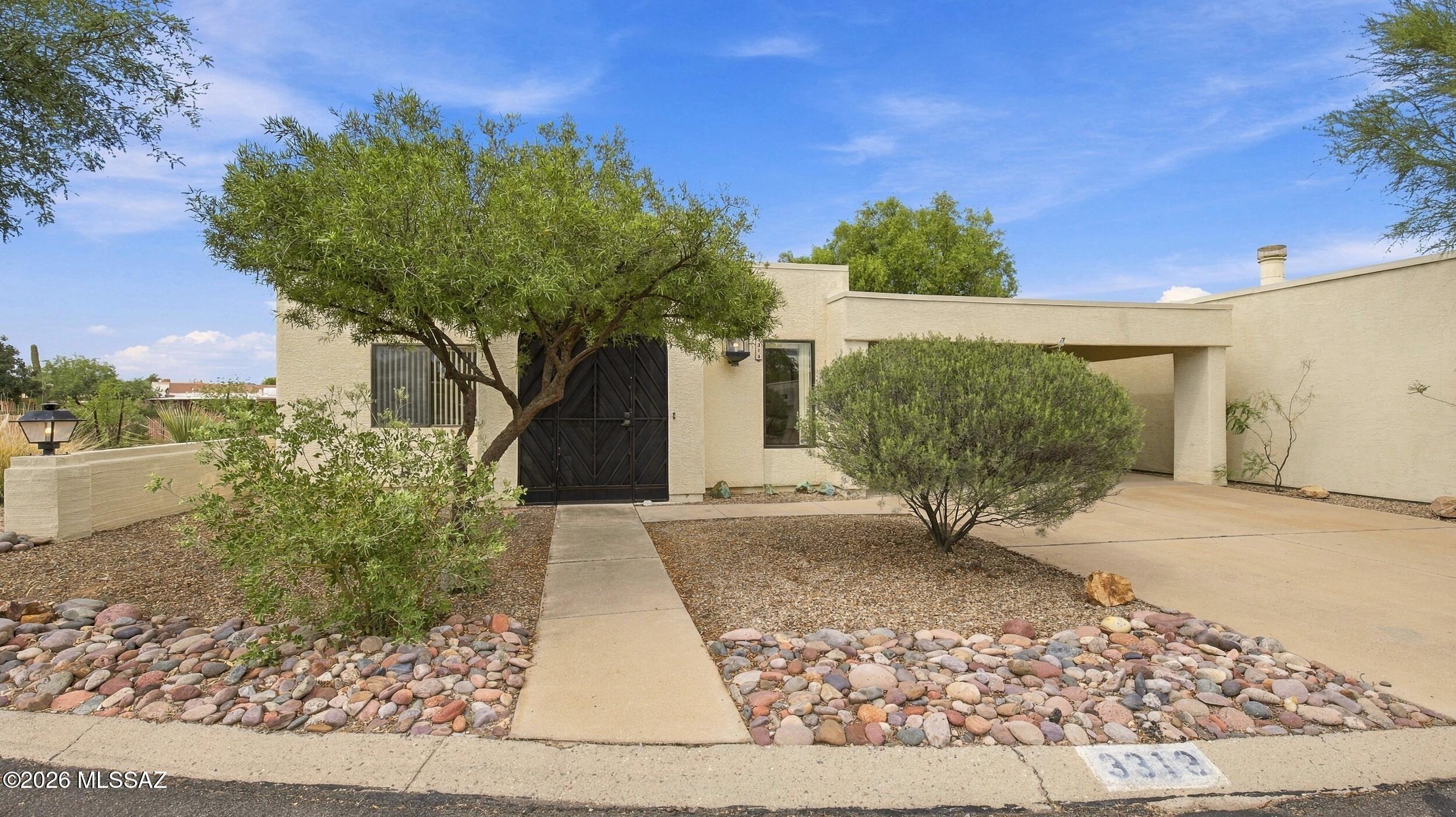 This charming Central Tucson home is situated on a desirable corner lot in a cul-de-sac and offers 3 bedrooms, a versatile den, 2 full bathrooms, and 1,492 sq. ft. of living space. Fresh interior paint gives the home a clean, refreshed feel, while the flexible floor plan provides plenty of room for everyday living, a home office, or additional flex space. Step outside to a private backyard with plenty of potential to make it your own, along with the convenience of a 2-car carport. Centrally located with easy access to shopping, dining, entertainment, and everyday conveniences, this home offers comfort, flexibility, and a convenient Tucson location.