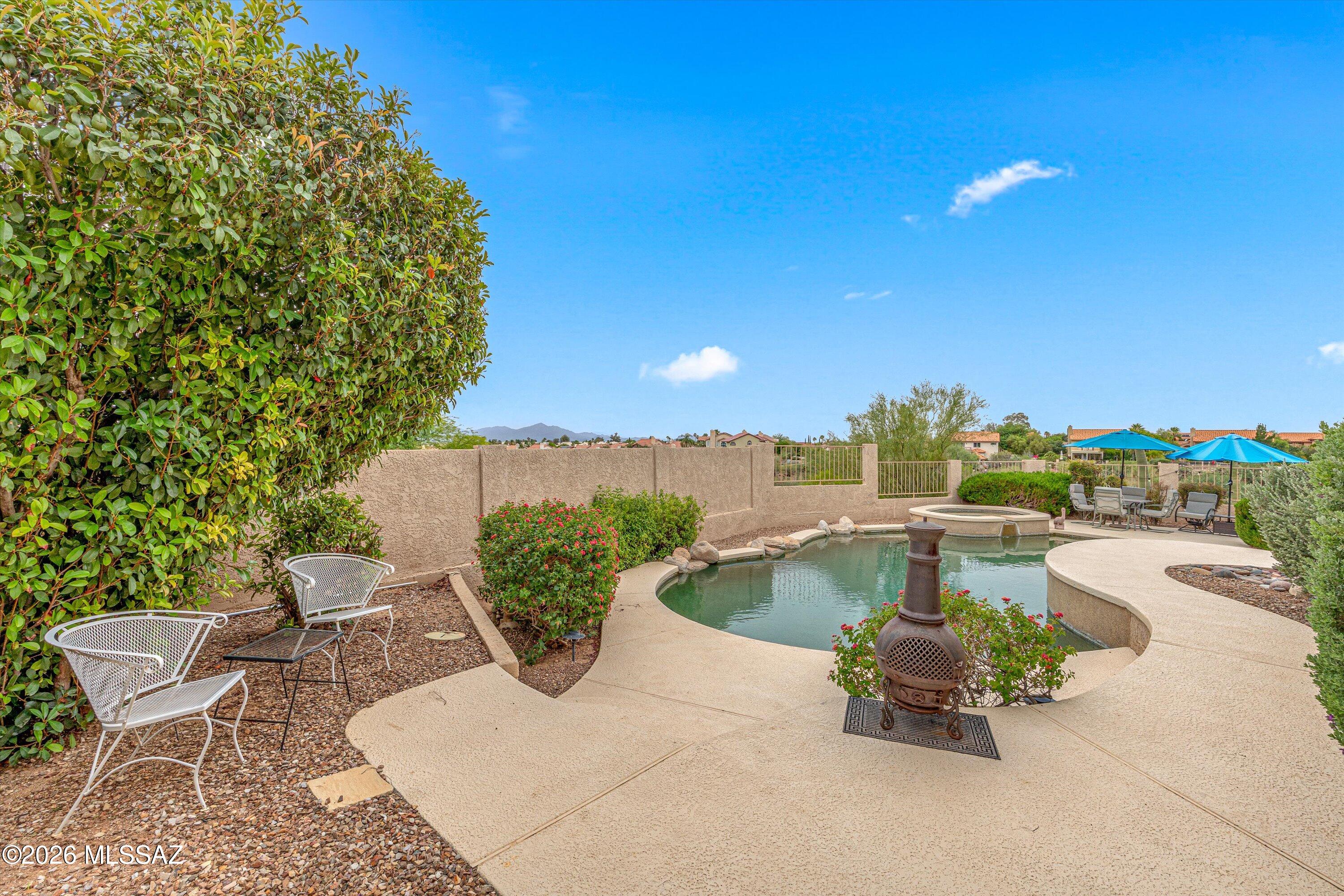 Beautifully maintained 4-bedroom, 3 full-bath home located in the highly desirable Copper Creek community. Backing to a wash with no rear neighbors, this property offers breathtaking views, and a true outdoor retreat. Enjoy the sparkling pool, view fencing, and gorgeous mountain and sunset views from the private balconies and backyard living spaces.
The thoughtfully updated kitchen features countertops and appliances all replaced within the last two years, blending modern style with everyday functionality. The flexible floorplan includes a convenient downstairs bedroom and full bath, ideal for guests, multigenerational living, or a home office setup. Pride of ownership is evident throughout with meticulous upkeep and numerous recent improvements, including a roof approximately 4 Years old and all rear-facing windows replaced in May 2026.
Additional highlights include a spacious three-car garage, generous living areas, and an ideal layout for both everyday living and entertaining. A rare opportunity to own a move-in ready home with privacy, views, and upgrades in one of Northwest Tucson's most sought-after neighborhoods.