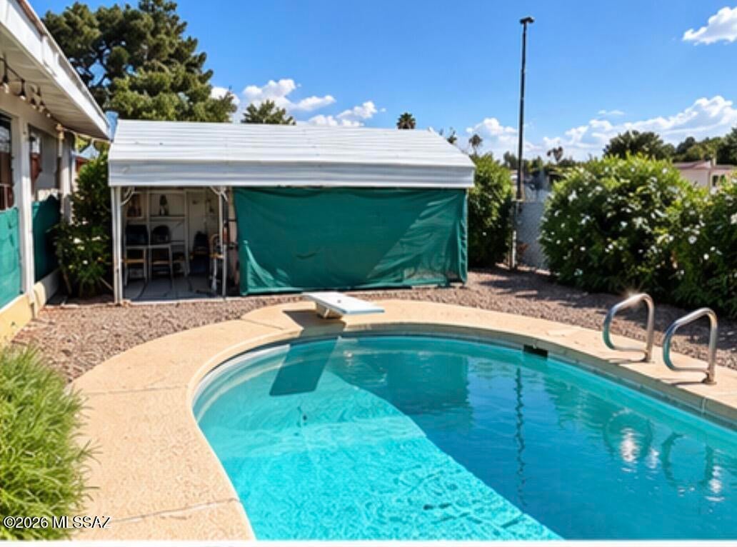 Come take a look at this Eastside Ranch Style Home with 3 bedrooms and 2 baths. Enjoy a bbq with large backyard and sparkling pool, covered patio with rolling shades and permitted metal awning. This homes offers a large workshop inside the 2 car garage, plus an additional garage /storage room for motorcycles or more. Enjoy low electric bills with the PAID OFF Solar. This home has NO HOA and is close to all major shopping ,bus lines and restaurants. Call for private showing.