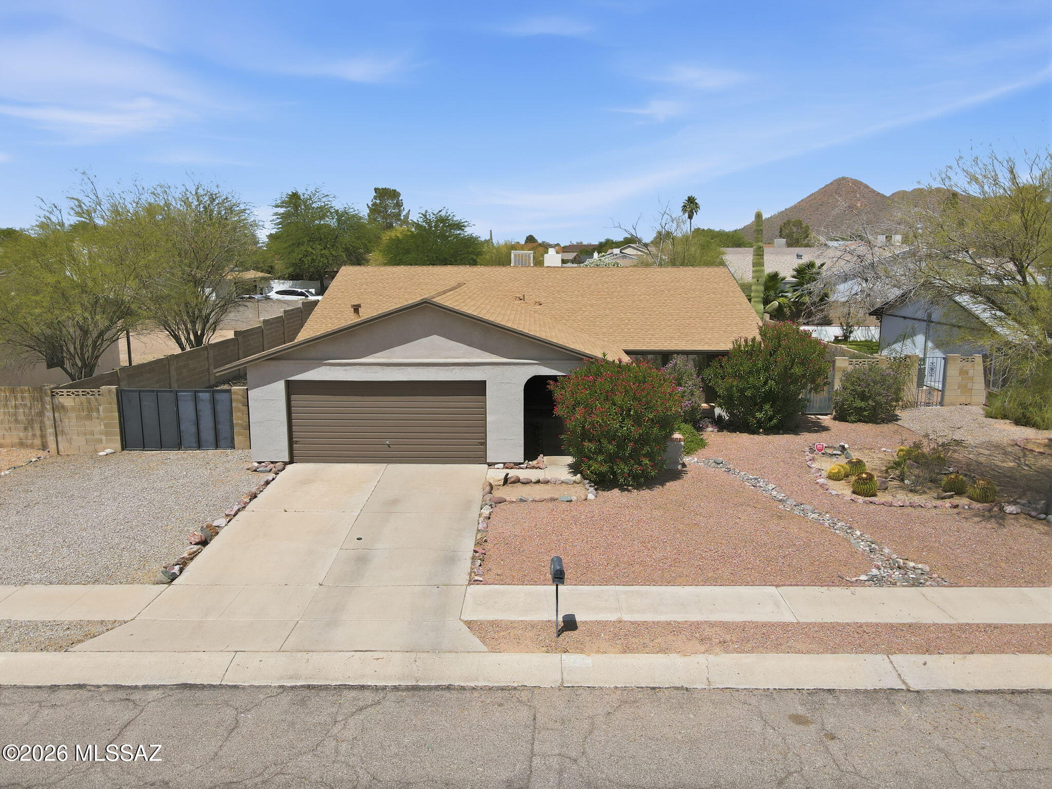 NO HOA! Welcome to this beautifully updated 4-bedroom, 2-bath home offering mountain views, mature landscaping, and a bright open layout filled with natural light. The inviting great room creates an easy flow for everyday living, while the family room fireplace adds warmth and charm. A dedicated dining   area provides the perfect space for gatherings, and the covered back patio extends your living space outdoors. The landscaped backyard is designed for low-care enjoyment and includes double gate access for added convenience. Updated, comfortable, and move-in ready-and did I mention, NO HOA!