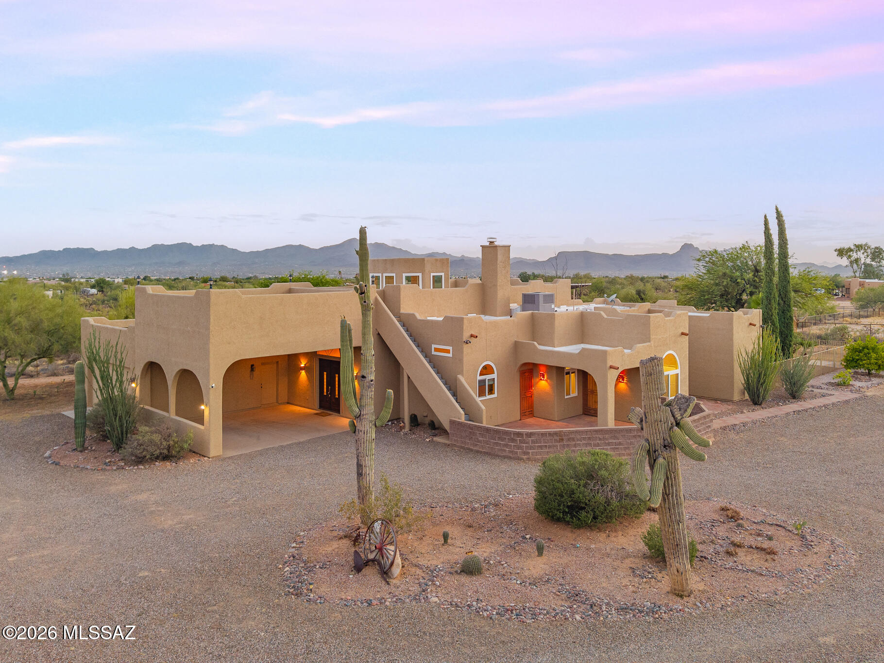 Range Pricing: Seller will entertain offers between $975,000 and $1,000,000. Welcome to a rare Northwest Tucson equestrian estate where wide open spaces, breathtaking mountain views, and thoughtfully designed horse facilities come together on 3.35 private acres. Beyond the gated entry, you'll find a property built for both horse enthusiasts and those seeking a true Arizona lifestyle. The professional 6 stall barn is complete with power, water, and a dedicated tack room, while the private riding arena, oversized workshop, RV hookup, and circular drive make daily operations effortless. The Santa Fe-inspired residence offers the perfect blend of comfort and functionality. Recent updates include owned solar, newer HVAC system, and updated windows. The kitchen features granite countertops, a cozy fireplace, and plenty of room to gather after a day outdoors.
One of the property's standout features is the attached guest quarters, complete with its own kitchen, living room, bedroom, and bath. Whether used for extended family, guests, a caretaker, the possibilities are endless. Step outside and experience what makes this property truly special. Spend your afternoons poolside in the newly resurfaced pool and spa, entertain beneath the covered patio, or unwind on the 360-degree rooftop deck as the Tucson sky transforms into a masterpiece of desert sunsets. Fully fenced and thoughtfully designed, this exceptional property offers the privacy, space, and versatility that are becoming increasingly difficult to find. Whether you're training horses, hosting family and friends, or simply enjoying the beauty of the Sonoran Desert, this is more than a home, it's a lifestyle.