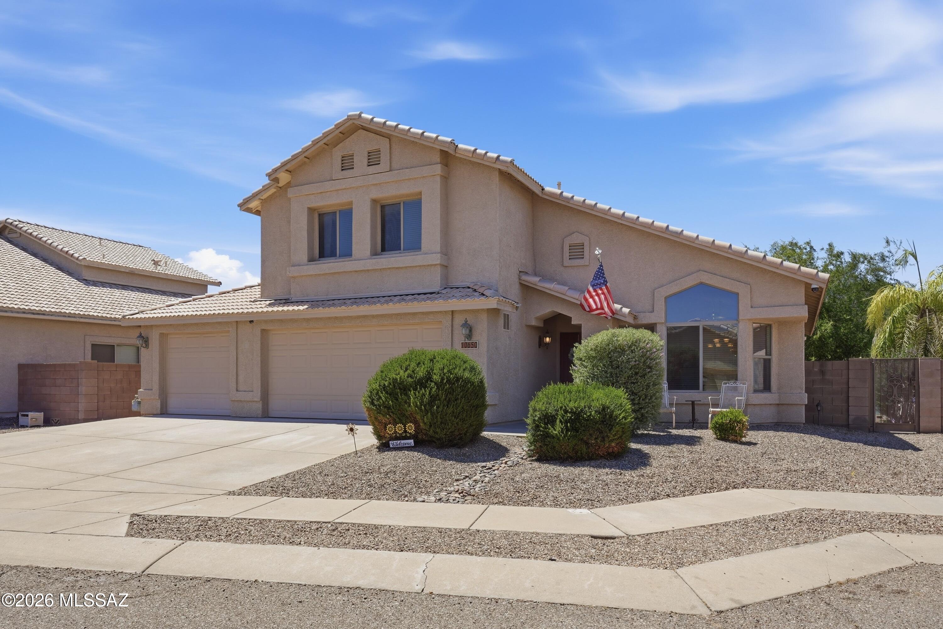 Located in the beautiful Mesquite Ranch community, This elegant 5 BD, 3 BA , 3 Car Garage home is move-in ready! A large a spacious floor plan with 2,908 sq ft of living space, this home has it all. New wood like vinyl flooring throughout, formal dining area, large bedroom and bathroom downstairs, oversized primary bedroom with walk-in closets, large primary bathroom, private balcony off master. Enjoy a serene and lush backyard with grass and tons of space to enjoy the desert lifestyle. This home is located in the highly rated Vails School District! Schedule your private showing today!