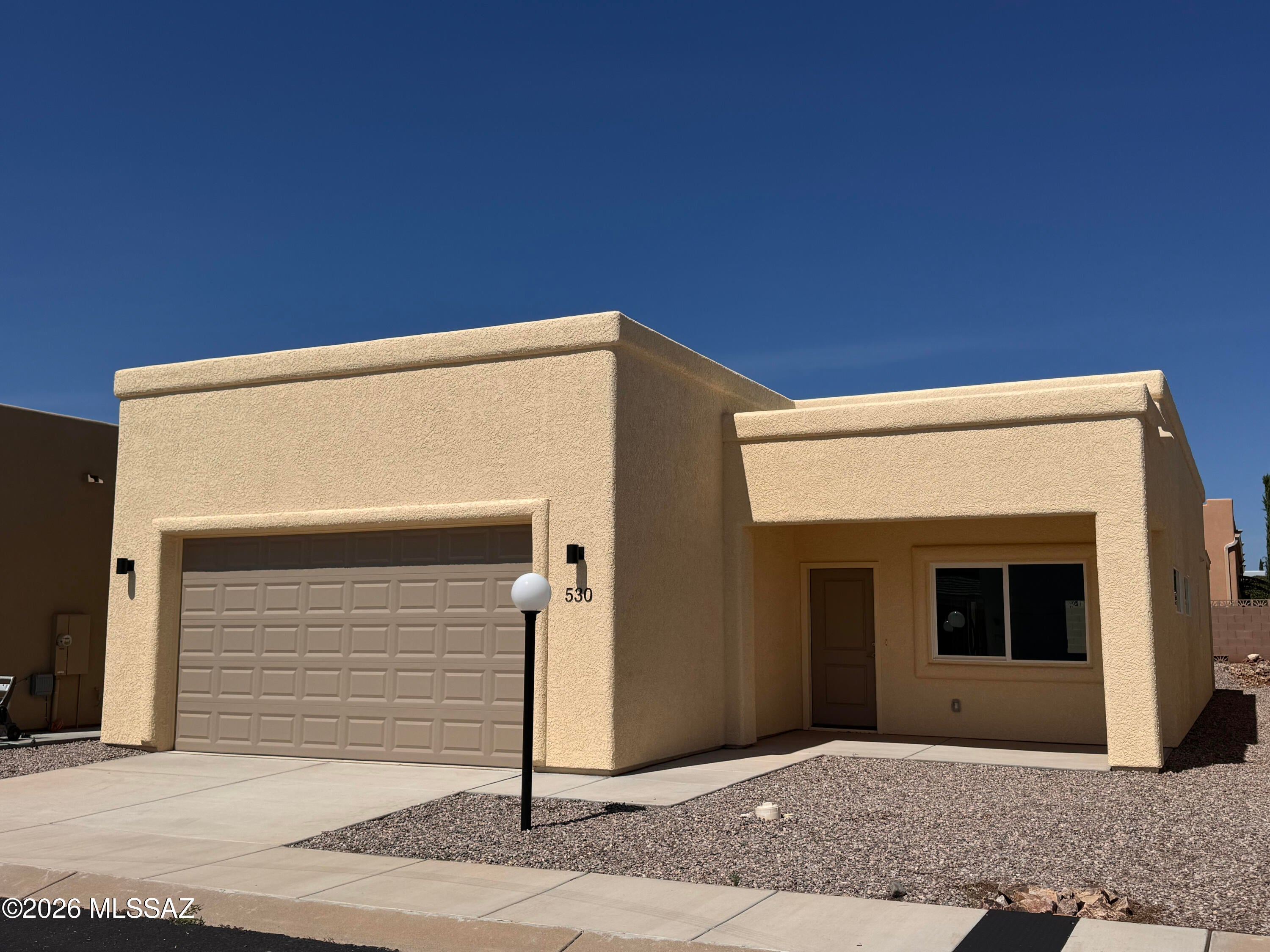 Discover the Dakota floor plan in the desirable 55+ community of Vista View Resort. This thoughtfully designed home offers 3 bedrooms, 2 bathrooms, 1,587 sq. ft., and a 2-car garage with a bright, open-concept layout. Features include tile flooring in the main living areas, carpet in the bedrooms, granite countertops, white cabinetry, skylights, recessed lighting, ceiling fans, 42-inch hallways, and 36-inch doors for added accessibility. Enjoy resort-style amenities including a heated pool and spa, fitness center, pickleball courts, clubhouse, dog parks, EV charging, and a full calendar of social activities. Monthly Resort Fee includes property taxes and trash service.