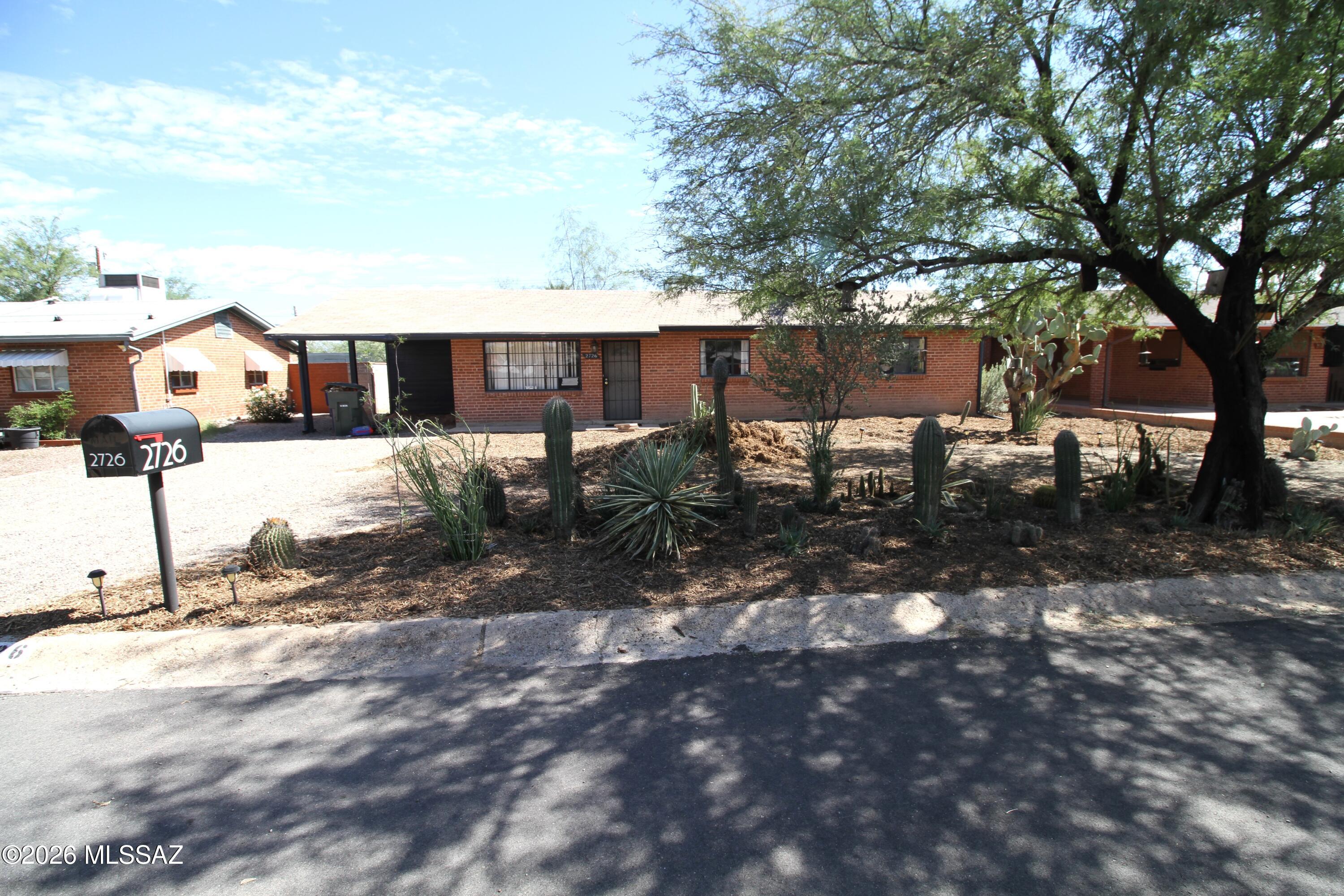 Spacious All Brick house, located in the heart of Tucson, Relax in a large back yard - perfect for entertaining.  Near to man amenities (Shopping, parks, schools, and more.   Needs a little TLC, but has great bones, and new floors.