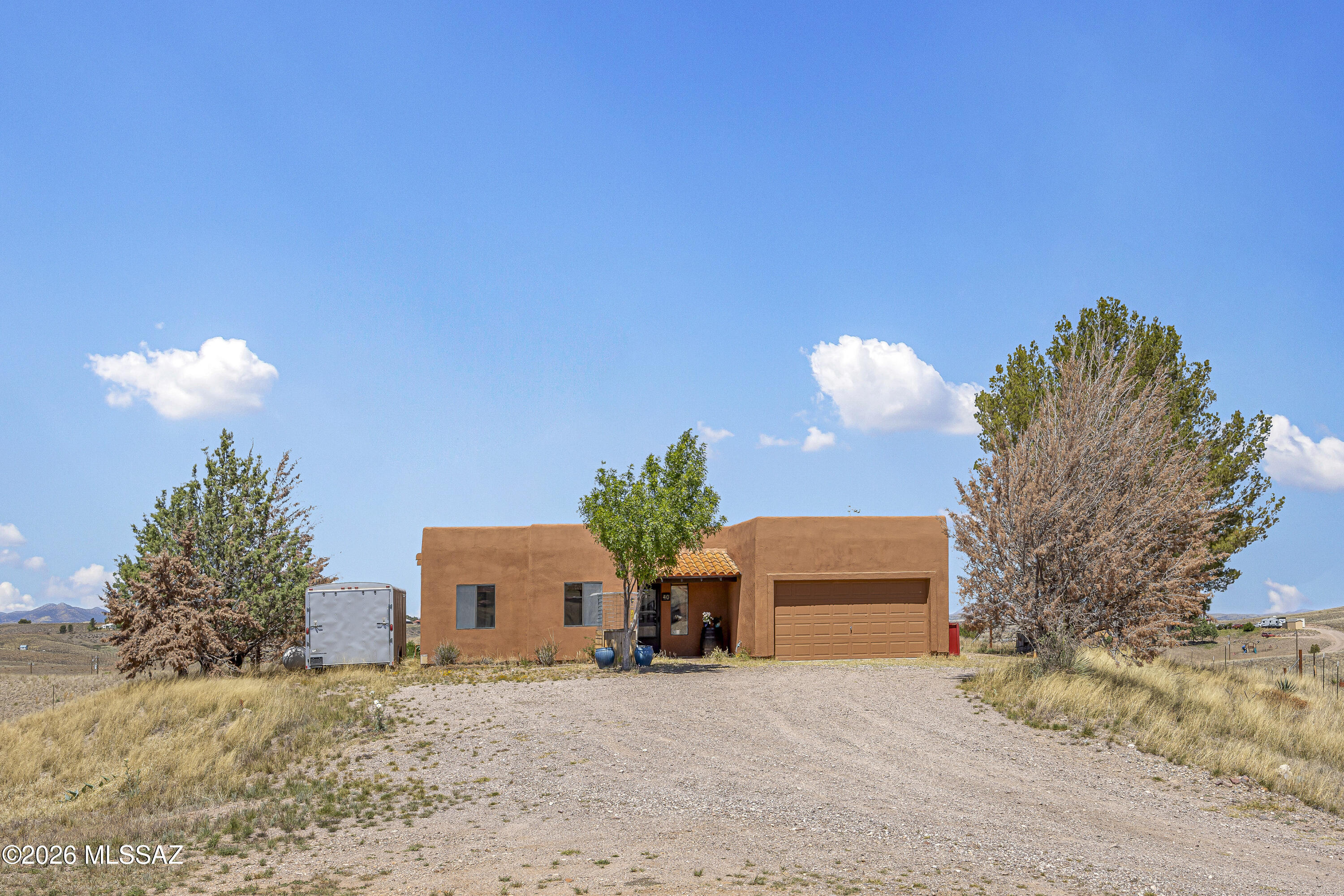 Beautifully updated home on expansive acreage in the heart of Sonoita's scenic wine country. This property offers the perfect blend of privacy, open space, and modern upgrades. Inside, you'll find a thoughtfully renovated kitchen with updated finishes, complemented by new flooring and an open-concept layout that enhances natural light and flow. Situated on over 3 acres, the property provides endless opportunities for outdoor living, horses, or simply enjoying the peaceful desert landscape, mountain views and beautiful sunrise & sunsets. With plenty of room to expand and no HOA, this is an ideal retreat for those seeking space and serenity while still being within a reasonable drive to Tucson.