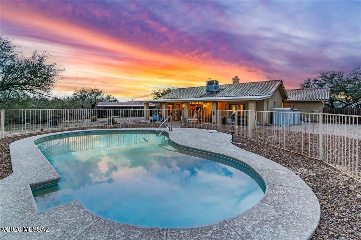 Motivated Seller! Freshly Painted inside-Set on an expansive .83 acre lot in coveted Northeast Tucson, this thoughtfully designed 3- bedroom, 2-bath residence offers the rare combination of space, privacy, and prime location. The light and airy interior with high ceilings, offer a functional split floor-plan. 
The backyard includes a large fenced pool, and RV hook ups installed, the property offers exceptional versatility for recreational living. 
Moments from hiking trails, schools, parks, and year-round outdoor activities, this home delivers the best of Tucson living and room to create something truly special.