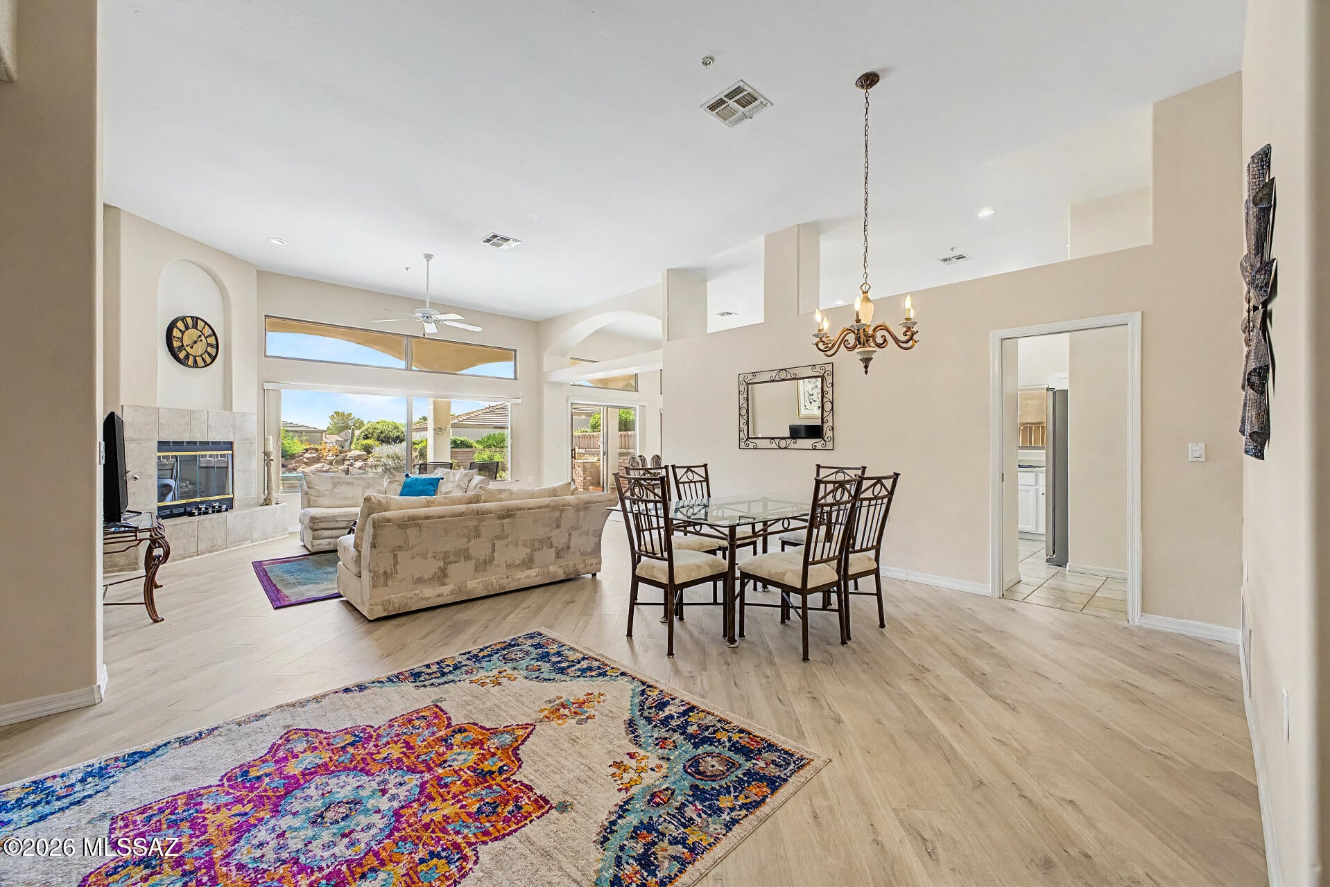 Seller will accept or counter offers between $365,000 - $385,000. Furnishings can be included.  NEW HVAC 8/15/26 - $68k in home improves. See Home Improves List 3D Matterport & Floor Plan available. Welcome home! Become the proud new owner of this charming 2-bedroom residence nestled in The Greens At Santa Rita Springs Community. Sleek interior showcases wood-look tile flooring, fire sprinklers, high ceilings, and abundant natural light. You'll surely LOVE the large living room offering mountain views and enhanced by a cozy fireplace that's perfect for relaxing evenings. Lovely kitchen comes with recessed lighting, built-in appliances, plenty of white cabinetry, and a peninsula with a breakfast bar. Spacious primary bedroom provides plush carpet, sliding glass doors to the back patio PLUS! Dedicated den/office.