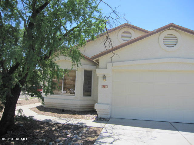 3BR 2BA with Tile and Wood flooring throughout. Large Kitchen has Breakfast Nook area and Bar. Extra Storage Pantry. All Kitchen appliances included. Separate Formal Dining Area off Kitchen. Fireplace in Family Room with Display Shelf. Spacious Master Suite w/Garden Tub and separate Shower. Dual Vanities. Extra Large Walk-in Master Closet. Big block walled in backyard with Covered Patio. 2 Car Garage. Washer /Dryer Hook ups. Central AC.