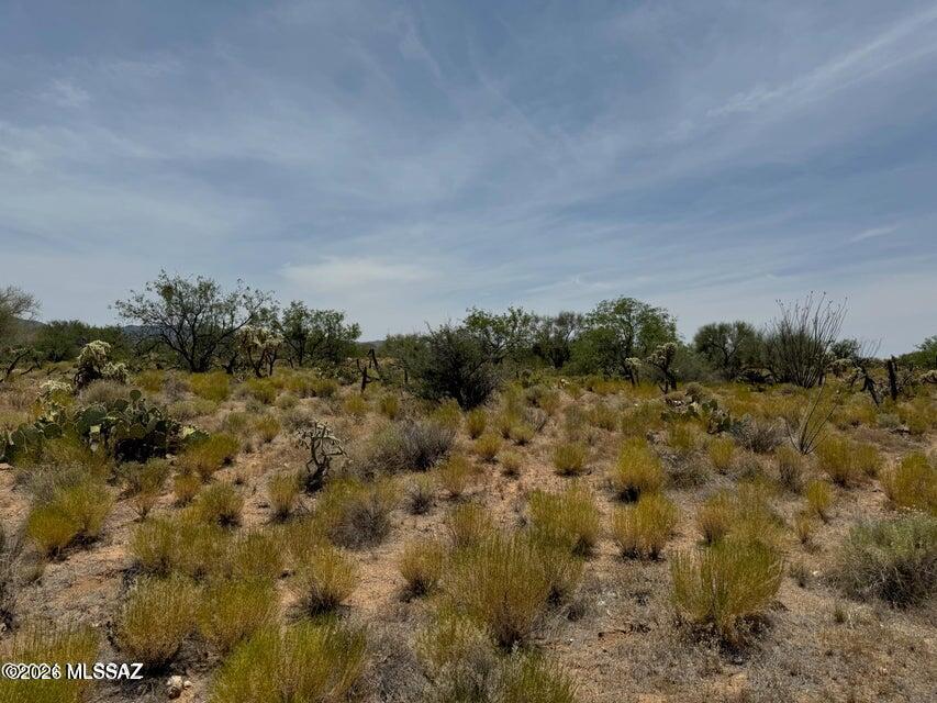 Large buildable lot in CR-1 zoned in Diamond Bell Ranch. Single Family homes only. Adjacent to a wash, easy access on dirt road, no utilities around so you must build off grid. Mountain views, sunsets galore! Make an offer today! Owner/Agent. Owner will carry.