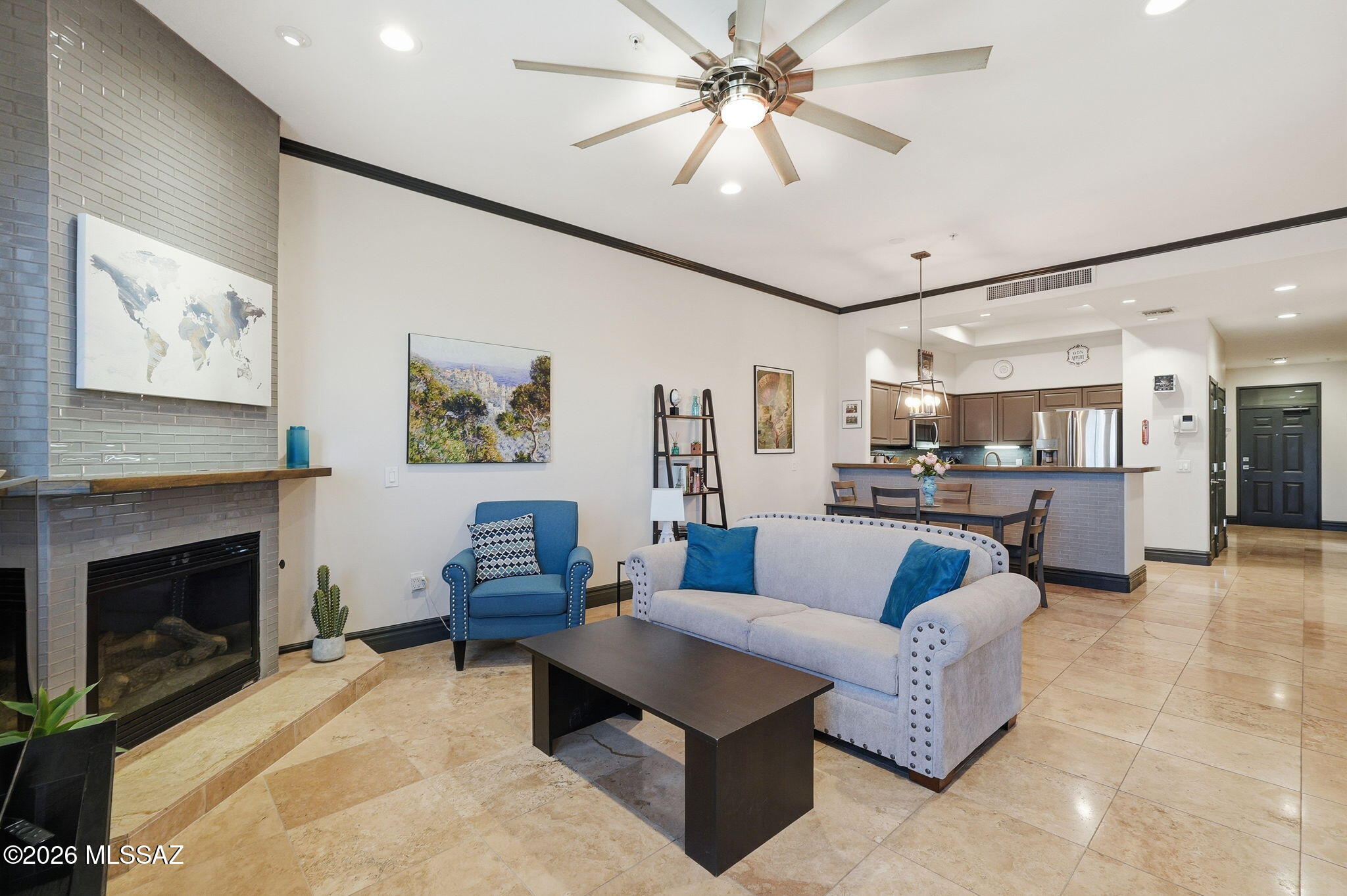 This condominium offers a blend of modern elegance and comfort. The kitchen is equipped with granite countertops and stainless-steel appliances, complemented by a convenient breakfast bar for casual dining or entertaining.
The unit includes two primary suites. Both feature dual vanities with granite countertops and relaxing soaking tubs.
There is also a powder room for guests. The living areas showcase stylish tile flooring, while the bedrooms have  carpeted floors for added warmth. A laundry closet, with stackable washer and dryer, adds practical convenience. The HVAC system was replaced in 2022. A gas fireplace enhances the living space with warmth and ambiance, From the spacious patio, you can enjoy views of the 
U of A stadium, 'A' mountain, city lights and breathtaking sunsets, offering a  picturesque and vibrant setting.