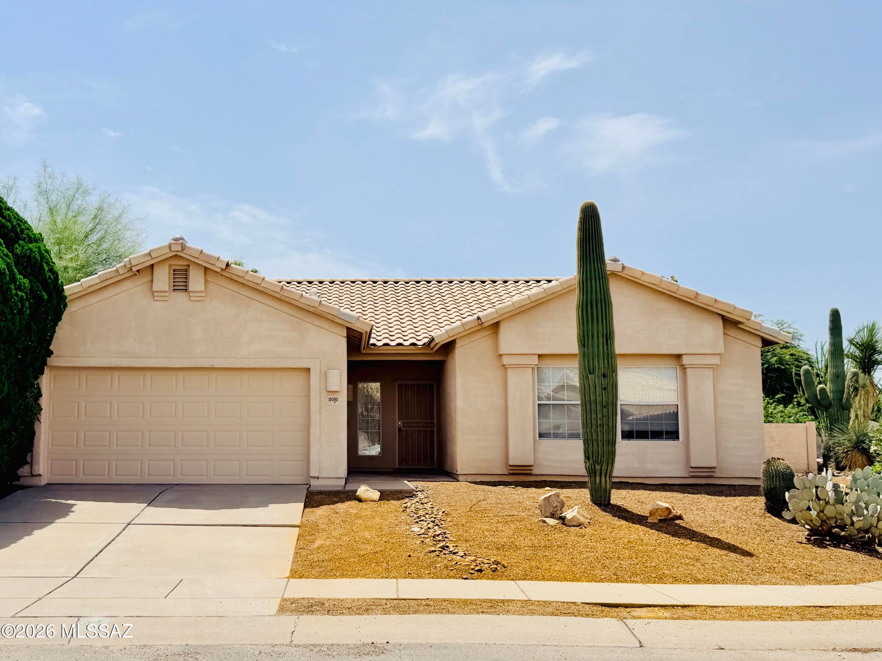 Don't miss this Rita Ranch charmer! Nestled on a corner lot on a cul-de-sac, this 3-bedroom, 2-bath home offers a welcoming open entry and a functional floor plan. The kitchen features abundant cabinet space, while bay windows fill the home with natural light. Enjoy excellent storage with a linen/coat closet and spacious walk-in closet in the primary suite. The large backyard and covered patio are ideal for outdoor entertaining, with a mature citrus tree adding an extra touch of Arizona charm. Conveniently located in desirable Rita Ranch, close to everything this popular community has to offer!