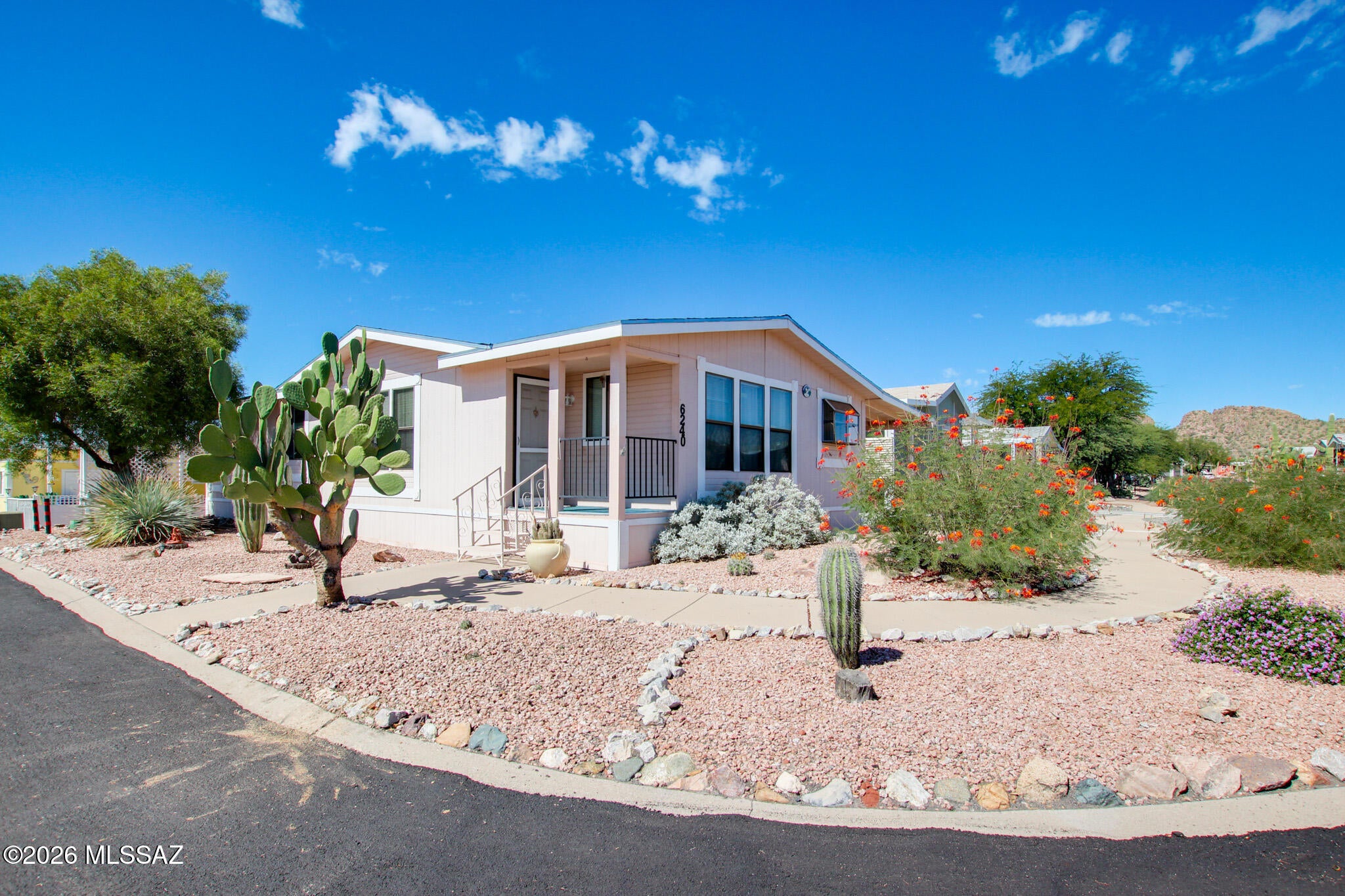 Discover comfortable, low-maintenance living in this 2-bedroom, 2-bathroom home in Mountainside Village, a 55+ community in Southwest Tucson.

Inside, the home features high ceilings, a spacious living room, and a dedicated dining room just off the kitchen. The kitchen includes stainless steel appliances -- a gas range, microwave, and refrigerator. The primary suite offers a double vanity, a separate shower, and a soaking tub. Outside, enjoy a covered, enclosed patio and low-maintenance landscaping. The home sits on a corner lot directly across from the clubhouse, with convenient access to the community pool and spa.