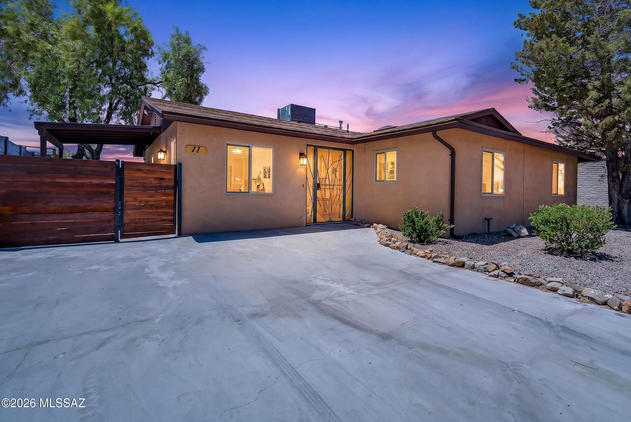 Move-in ready furnished retreat in Corona de Tucson -- award-winning Vail School District, minutes from Raytheon, Davis-Monthan AFB & Tucson's top medical centers. Queen bed (primary suite, 2 walk-in closets) & full bed (guest room). Fresh linens & extra bedding included. Full cookware, dishes, silverware, coffee maker & toaster stocked. Granite counters, stainless appliances, gas stove & dishwasher. Tile/wood floors, carpeted bedrooms, ceiling fans throughout, faux wood blinds. In-unit W/D. Covered patio with unobstructed Santa Rita Mountain & desert views -- sunsets & starry skies. Utilities (electric, gas, water) included up to $325/month, high-speed WiFi & trash included. Quick I-10 access -- 20 min to DMAFB, Raytheon, Banner UMC & TMC. Tenant has exclusive use of all other areas as described. Guest suite is inaccessible and not included in this rental.  Listed by Owner/Agent.