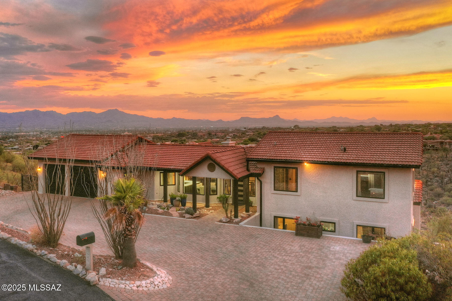 Stunning home located in exclusive Sin Vacas neighborhood, offering breathtaking Catalina, Tucson Mountain & city views. Every aspect of this home has been touched & improved making this generous 3,960 square gem perfect for comfortable living & entertaining. Situated on a 1.3-acre lot this home features 5 bedrooms & 4.5 bathrooms that have all been tastefully remodeled to offer a modern & luxurious living experience. Step inside to discover new flooring throughout the home, creating a fresh & long lasting contemporary look. The addition of new doors, windows, & garage doors in 2022 enhances the overall aesthetic & provides improved functionality. This home also boasts updated heating, ventilation & air conditioning (HVAC) systems + 2 new hot water heaters... installed in 2022, ensuring optimal comfort and efficiency. Additionally, the installation of new owned solar panels in 2022 combined with low E windows results in $10 average electric bills. The kitchen has undergone a stunning remodel, featuring new backsplash, appliances, quartz countertops & cabinets. These upgrades offer both functionality & style, making it a chef's dream come true. The home has been equipped with new window treatments, including motorized shades in the living & family rooms, allowing for effortless light control & privacy. Stacking doors have been added to create a seamless transition between indoor & outdoor living spaces, perfect for enjoying the beautiful surroundings. The exterior of the home has been freshly painted in 2023, providing a polished & updated appearance. With a transferrable 10-year warranty. Additional features include Catalina rip rap at the front of the home, a paver driveway, repainted interior doors, new turf installed in yard & 8x8 exterior wood pillars. These enhancements add to the overall curb appeal of the property. This beautiful masonry built home offers a blend of modern upgrades, luxurious finishes & stunning views, creating an exceptional living experience in the coveted Sin Vacas neighborhood. Welcome Home!