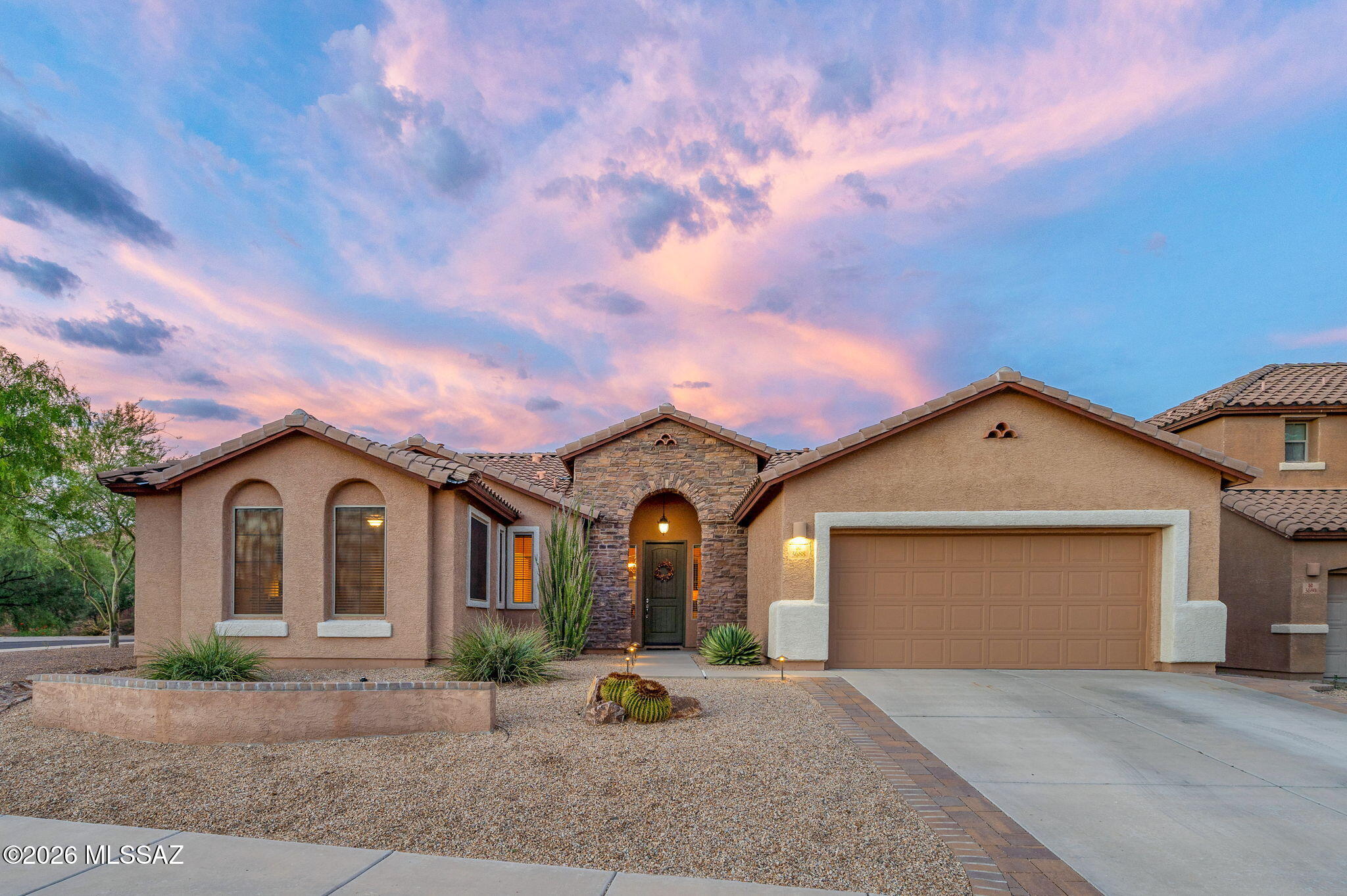 This 4BR/2BA single-story home sits on an oversized corner lot in Marana's gated Tangerine Crossing community. The split floor plan offers privacy for all, while the family room off the kitchen keeps everyday living connected. The kitchen features abundant cabinetry and generous granite counter space w/ island, an ideal for cooking and entertaining.

Continue the entertaining out back and enjoy a pebble-tec pool with a tranquil waterfall and Tortolita Mountain views -- the ultimate desert backyard. This home has been meticulously maintained and is move-in ready for you to enjoy.