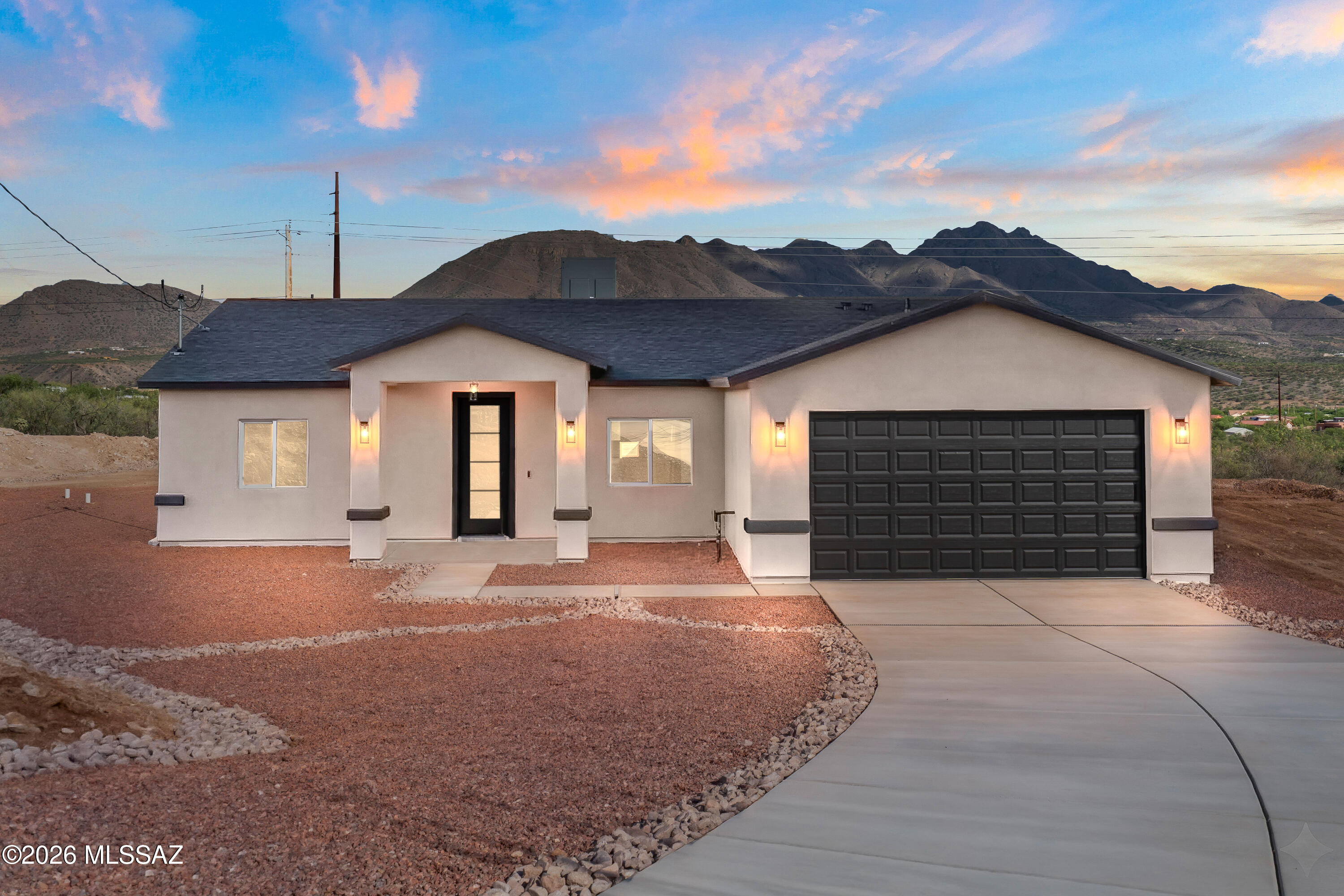 Welcome to this beautifully situated 3-bedroom, 2-bath home offering 1,565 square feet of comfortable living space on a generous half-acre lot. Enjoy breathtaking mountain views right from your backyard, creating a serene and scenic backdrop for everyday living.

Inside, the home features durable ceramic tile flooring throughout and stylish quartz countertops that bring a modern touch to the kitchen and living spaces. The layout offers both functionality and comfort, ideal for families or those who love to entertain.

This unique property provides dual access for added convenience--entry from the front on Calle Alarcon, with additional access from the backyard along Josefina Rd. The expansive lot offers plenty of room for outdoor living, gardening, or future customization.