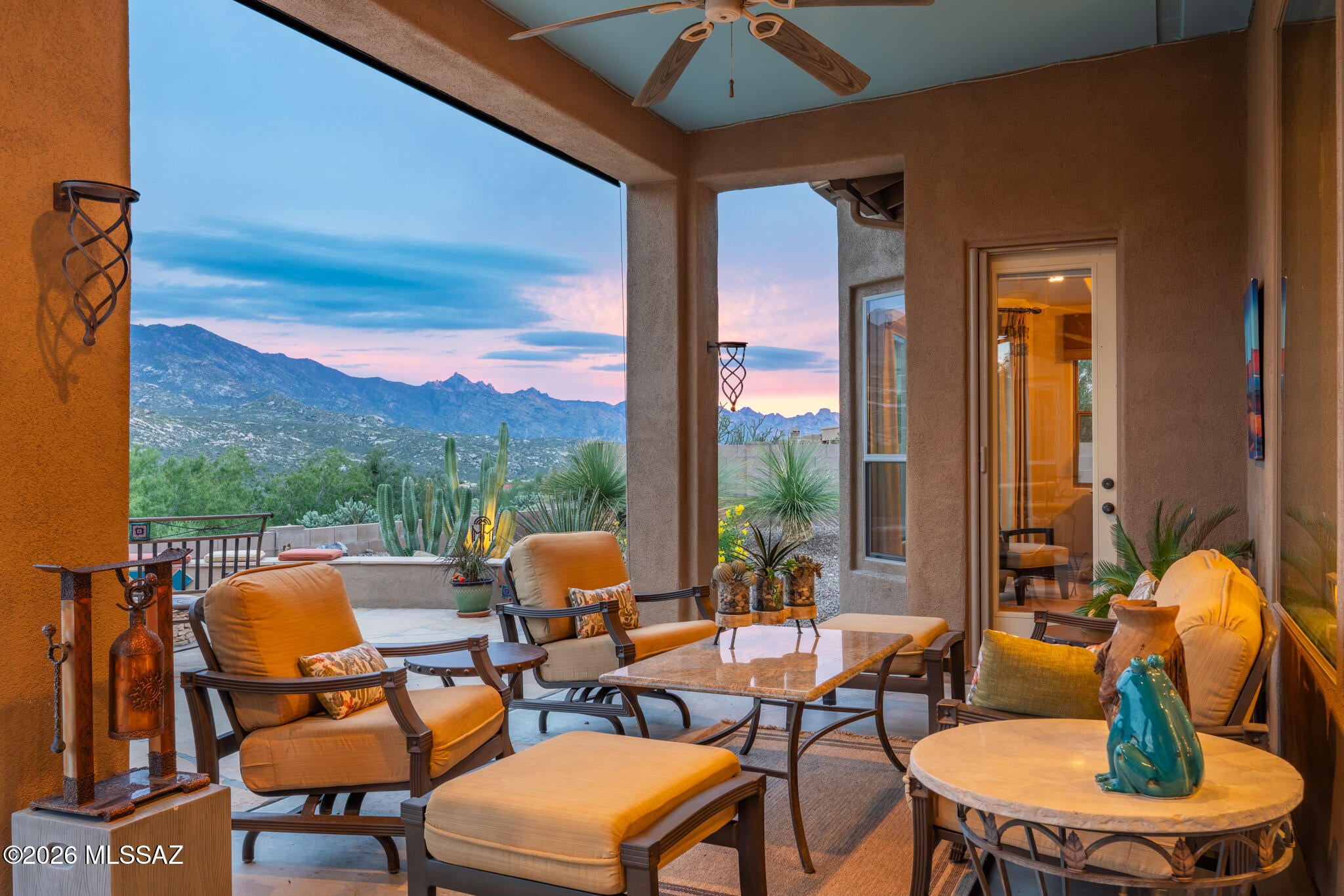 Panoramic Catalina Mountain views take center stage in this exceptional Sabino with casita in The Preserve at SaddleBrooke. Elevated above the golf course on a wide, private lot, the home captures breathtaking vistas from the living spaces and expansive rear patio. The enlarged kitchen adds a 10' x 10' dining, bar and sitting area, with newer stainless appliances, granite counters and a prep island. A beautifully appointed den offers custom cabinetry, while the living room features expanded windows and a custom entertainment center. Wood floors throughout the main living areas. The casita includes a Murphy bed, craft desk, walk-in closet and soaking tub/shower. Enjoy the resort-style backyard with water feature, firepit and multiple seating areas. New HVAC in 2026 completes this retreat.
