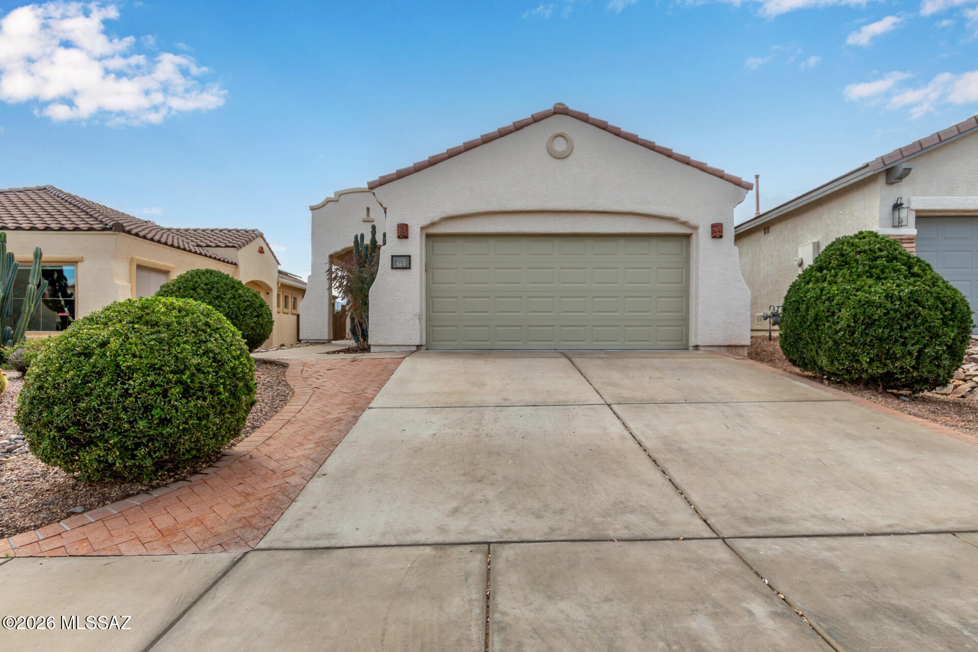 Look no further! This beautiful 2 bed, 2 bath property in Rancho Sahuarita (55+)is the one for you! Featuring great curb appeal, a low-maintenance desert landscape, pavers, and a 2 car garage w/built-in cabinets. Come inside to discover a spacious living room w/elegant wood-look flooring and crisp palette throughout, The eat-in kitchen is equipped w/everything you'll need for home cooking, ample cabinetry, quartz counters, tile backsplash, and stainless steel appliances. Enjoy a good night's sleep in the primary suite, boasting soft carpet, a private bath w/dual sinks, and a walk-in closet for all your belongings. Lastly, the sizeable backyard w/its covered patio and artificial turf, is the perfect place for a summer cookout w/friends & loved ones! Hurry, act now!