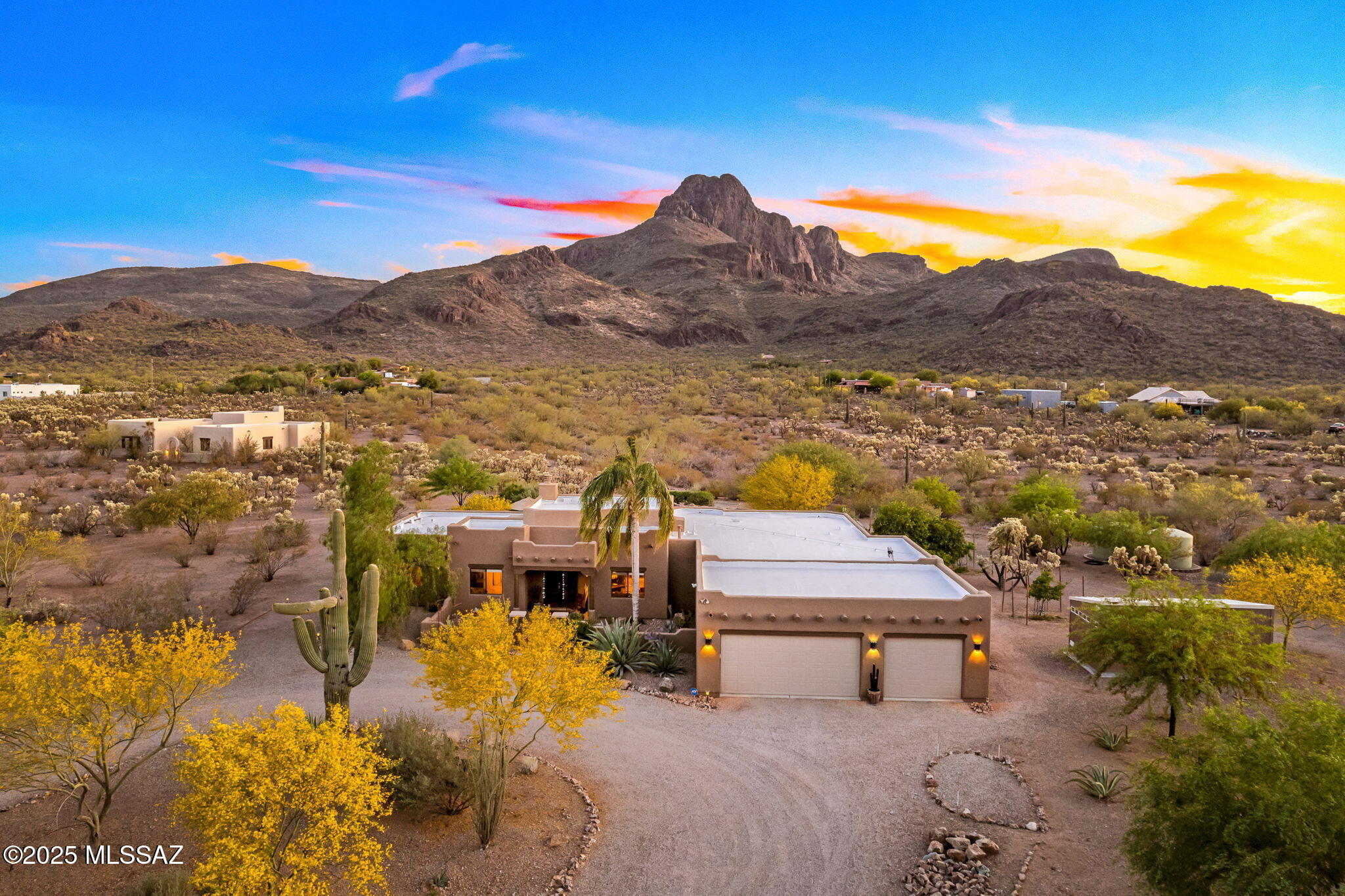 Secluded on 3.33 acres with unobstructed views of Sombrero Peak, this meticulously maintained home offers exceptional privacy and panoramic scenery. Enjoy expansive patios, a sparkling pool, built-in BBQ, and outdoor fireplace—ideal for entertaining or quiet evenings. Inside, a flexible layout includes a multipurpose room and two bonus rooms—perfect as extra bedrooms, office, or gym. The gourmet kitchen features high end appliances. Property includes a detached storage building and second gated entrance. Located near hiking, shopping, and dining. A rare opportunity you don't want to miss!