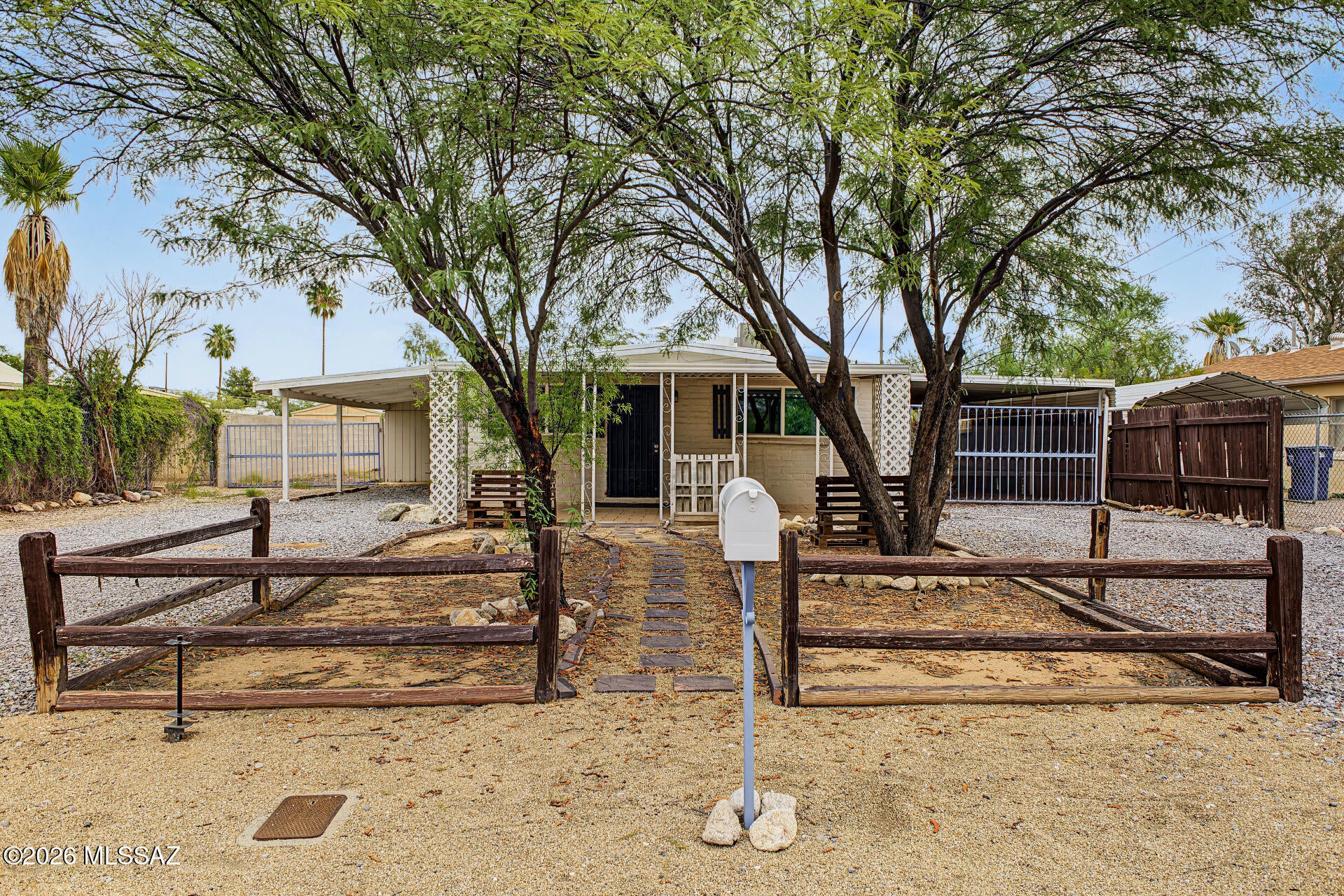 Vacant and move-in ready! Remodeled 3 bed, 1 bath home on a large 8,712 sq ft R-2 lot in the heart of Central Tucson. The updated kitchen has quartz counters and stainless appliances, with plank tile flooring throughout and a fully remodeled bath. Gather around the rock-veneer wood-burning fireplace in the great room, stay comfortable with central A/C and ceiling fans, and unwind on the covered back patio. The 4-car tandem carport plus RV space leaves room for all your vehicles and toys. R-2 zoning offers room to expand or potential for an ADU (buyer to verify). Minutes from U of A, hospitals, shopping, parks and bus lines. Live in it, rent it, or build on it!