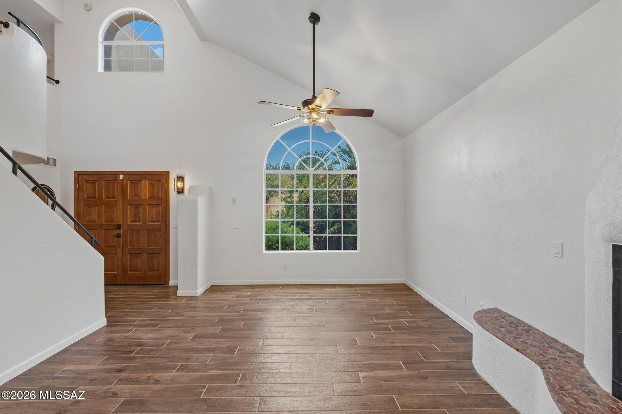Lovingly maintained, southwest-style, suburban home in the heart of Tucson's prestigious, historic Old Fort Lowell neighborhood - minutes away from premium retail, upscale dining, and world-class recreation. Indoors, enjoy newly updated flooring on ground-level, lofty entry & living room with high ceiling & tasteful fireplace open to formal dining area, open-concept kitchen with gallery hall into family/great room, long corridor leading to first floor bedroom (great for guests or even multigenerational living), full bathroom, and further to laundry room adjacent to flex space with its own door and mini-split.

Remaining bedrooms upstairs, with outstanding Owner's Suite that includes walk-in closet, plus spa-style bathroom with double vanity, and standing shower separate from soaking tub. Outdoors, gated & enclosed front walkway wraps around to sprawling, walled, well hardscaped backyard, overlooking central community green space & meandering mesquite trees - making for a sophisticated setting that provides a perfect combination of options from serene sanctuary to enticing entertainment.

Preferred location and dynamic features of this versatile property make it ready to be a stellar starter for first-time homebuyers, an exciting change for seasoned homeowners, or a solid asset with income potential for savvy investors.