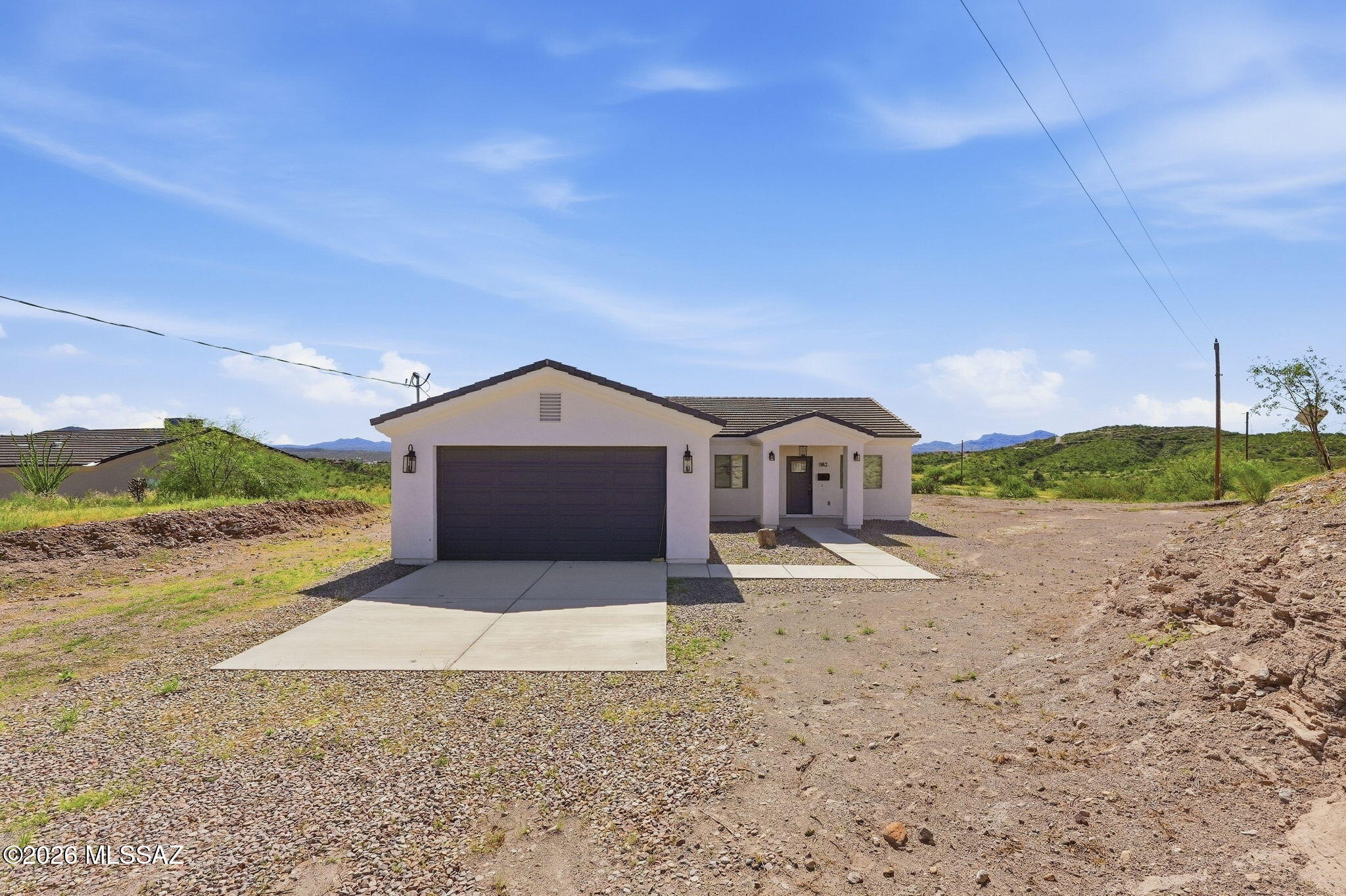 Welcome to 1182 Paseo Matamoros in Rio Rico! Built in 2023, this beautiful 3-bedroom, 2-bath home still has that fresh, newer-home feel! Offering 1,579 square feet of comfortable living space and situated on a spacious 0.72-acre lot, this property provides the perfect combination of modern living, space, and privacy. The functional layout offers comfortable living areas with plenty of room to make the home your own. Step outside and enjoy the generous lot, peaceful surroundings, beautiful desert landscape, and open Arizona skies. With newer construction and plenty of outdoor space to enjoy, this home is ready for its next owner.
