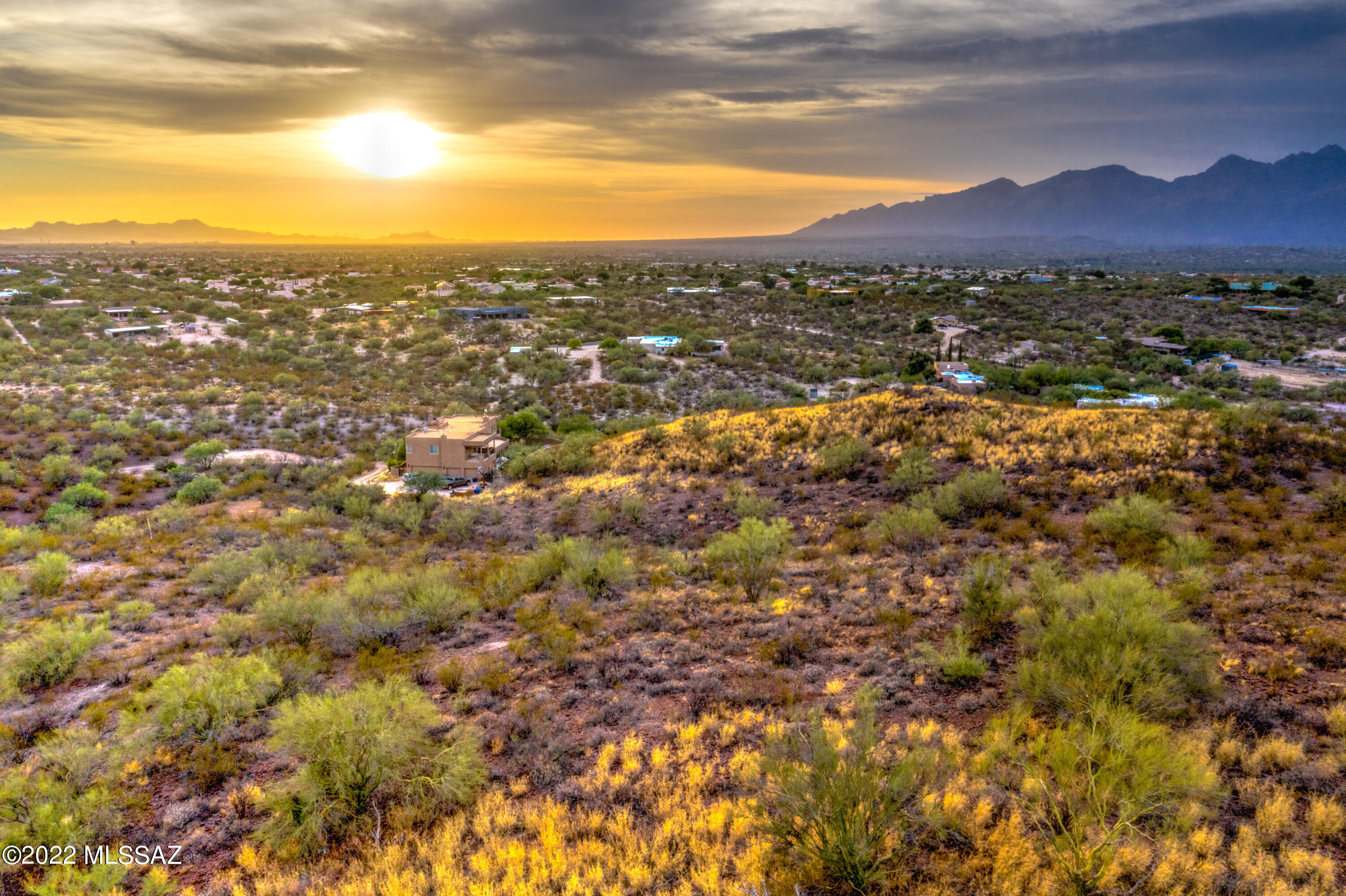 Rare opportunity to own a 3.35-acre, unsubdivided hillside parcel on Tucson's Eastside. This north-facing lot is positioned near the top of one of the area's highest hills, offering expansive city, mountain, and sunset views. The lot is designated horse property and provides ample space for a custom homesite and related improvements. Elevated topography offers privacy and scenic surroundings while remaining conveniently located—approximately five minutes from Saguaro National Monument East and less than ten minutes from Houghton Northwest Hospital, shopping, dining, and entertainment. Buyer to verify zoning, utilities, access, and development feasibility. Ideal for those seeking space, views, and a blank canvas to create a custom vision.