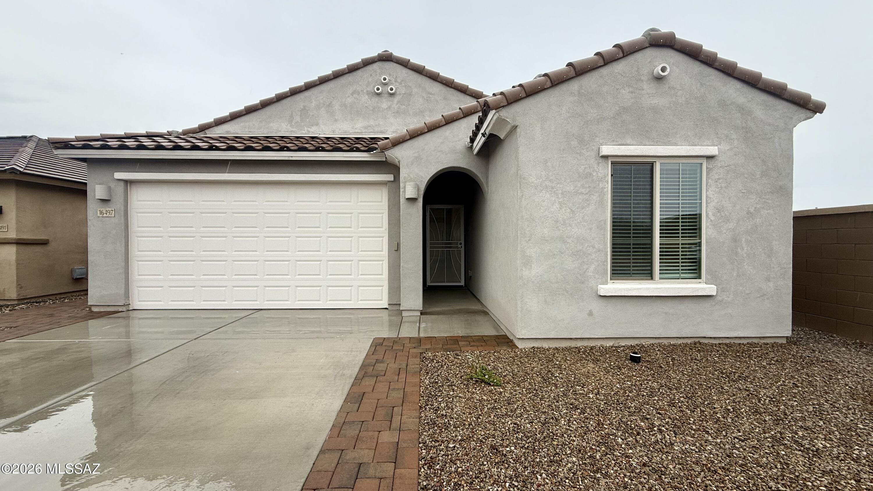 Enjoy a desirable single-story floor plan featuring an inviting great room concept and neutral flooring throughout. The charming kitchen offers a breakfast bar, pantry, and includes essential appliances such as a refrigerator, oven, microwave, dishwasher, washer, dryer, and AC unit for added convenience. The home is complete with a 2-car garage and is ideally located in Sahuarita, close to schools, parks, dining, and entertainment. Residents also enjoy access to community amenities, including a sparkling community pool, making this home both comfortable and well-situated.