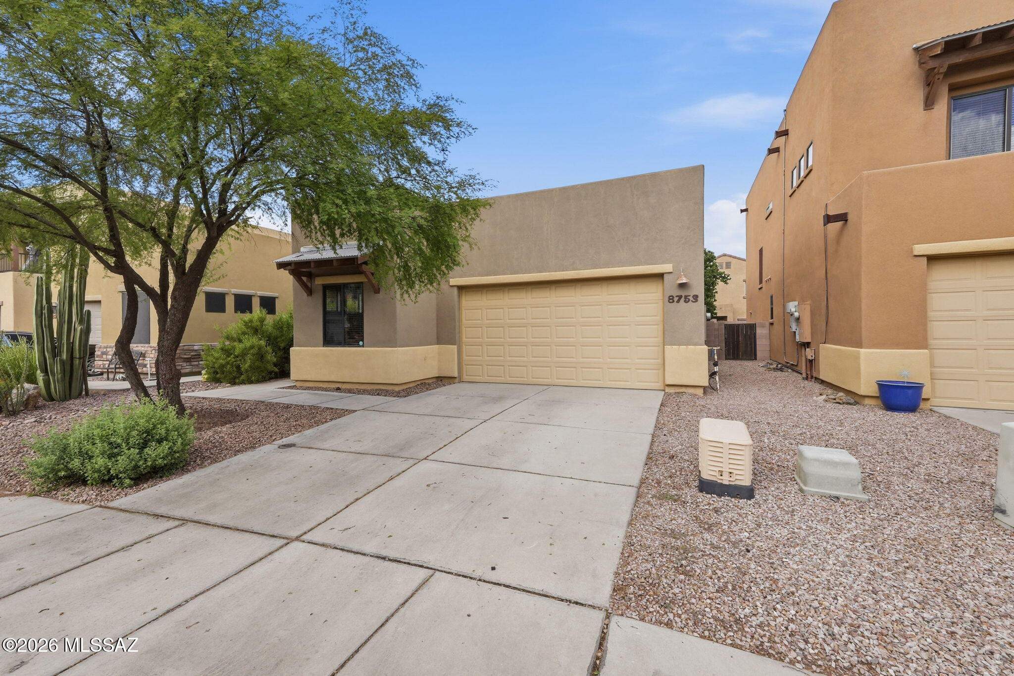 Tucked within the gate community of The Pines, this inviting home is part of a small enclave of quality-built Miramonte residences. The durable Dryvit exterior provides added insulation for energy efficiency, while two-tone paint & a covered entry create a welcoming first impression. Step inside to a clean, bright & freshly painted interior. The spacious great room features 12-foot ceilings, clerestory windows & warm wood-look flooring, creating an open, light-filled gathering space. The kitchen offers granite countertops & a new dishwasher. The owner's suite features dual sinks & a huge walk-in closet, with carpeted secondary bedrooms. Enjoy The Pines' community pool & park, perfect for relaxing & enjoying the Arizona lifestyle.