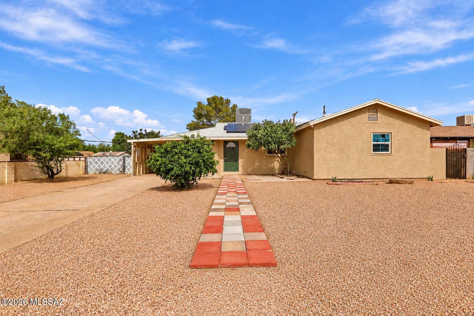 Fully renovated, five bedrooms, and solar that's already paid for, this Tucson home delivers move-in-ready space with real monthly savings. The owned system carries no loan or lease payment, and one-for-one net metering lets the power it produces offset your electric bill. Inside, approximately 1,306 square feet and 2 updated bathrooms give you room for a home office, guest room, gym, or hobby space without sacrificing a bedroom. Outside, the approximately 0.18-acre lot offers room for outdoor dining, gardening, or relaxing under Tucson skies, and covered parking keeps your car out of the summer sun. With the renovation done and the solar paid off, the hard work and the big expenses are already behind you.