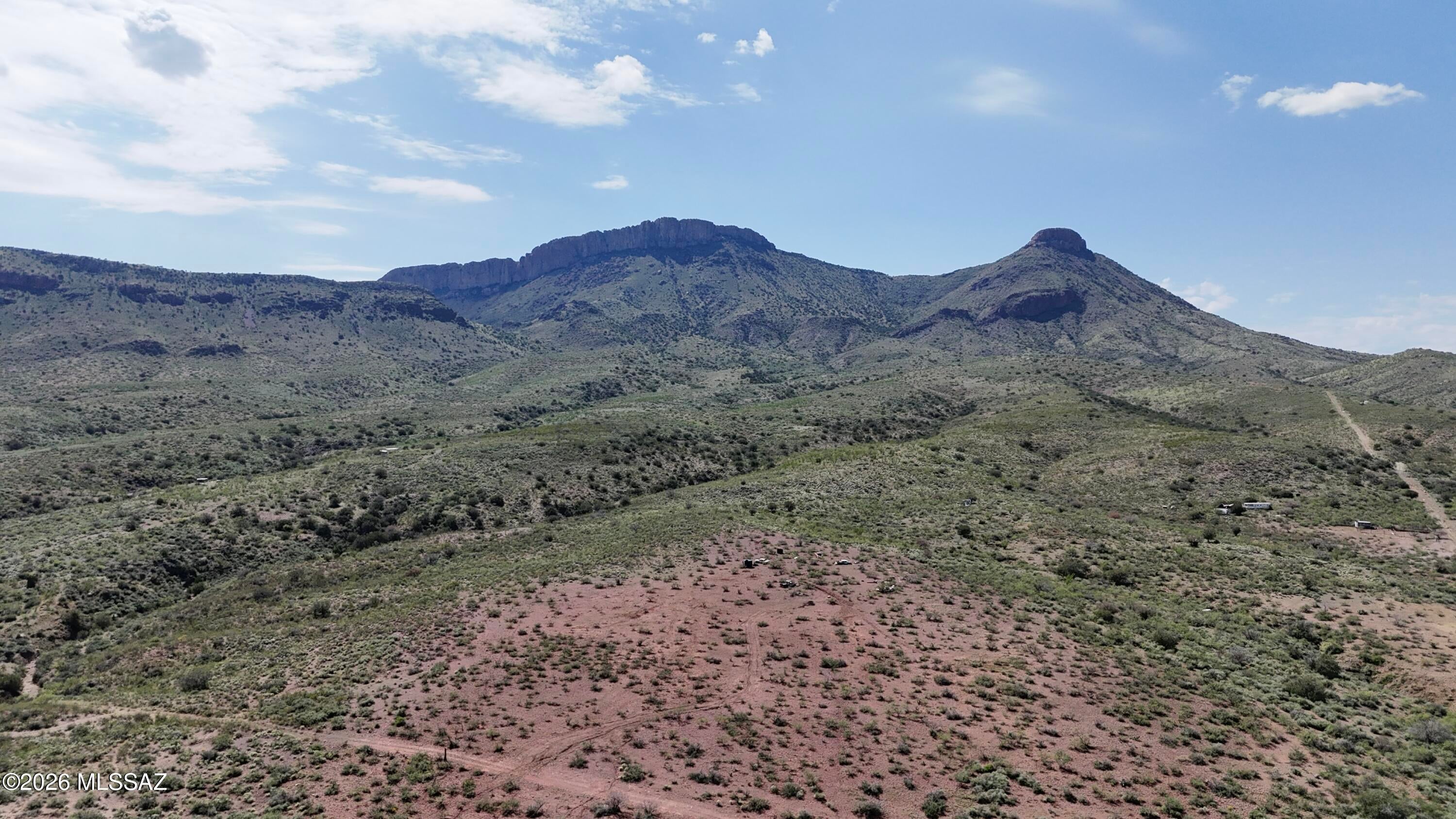 Forty acres of Southern Arizona beauty in every direction. Near the base of the mountains, this Silver Creek Ranch parcel offers sweeping mountain and bluff views, with sightlines stretching into Mexico. Cacti, seasonal wildflowers, wildlife, and fascinating rocks make it a dream for nature lovers, birders, and outdoor enthusiasts.
A wash gives the property depth and character, while a flatter area offers possibilities for your dream home. Imagine adding your own hiking trails, watching the sunrise and sunset, and ending the day beneath a brilliant night sky. You could also explore splitting the acreage for multiple homesites, subject to county approval.
The property has a private well, APS power service, a water storage tank and piping, RU-4 zoning, and excellent reported 5G cell servic Silver Creek runs seasonally just below the parcel, and Douglas is approximately 15 minutes away. Silver Creek Road is rough but relatively short, don't let that deter you from seeing, living and experiencing this AMAZING property!! Old vehicles on the property will convey.
 Come experience the views and the quiet for yourself--photos can only capture so much of this place.