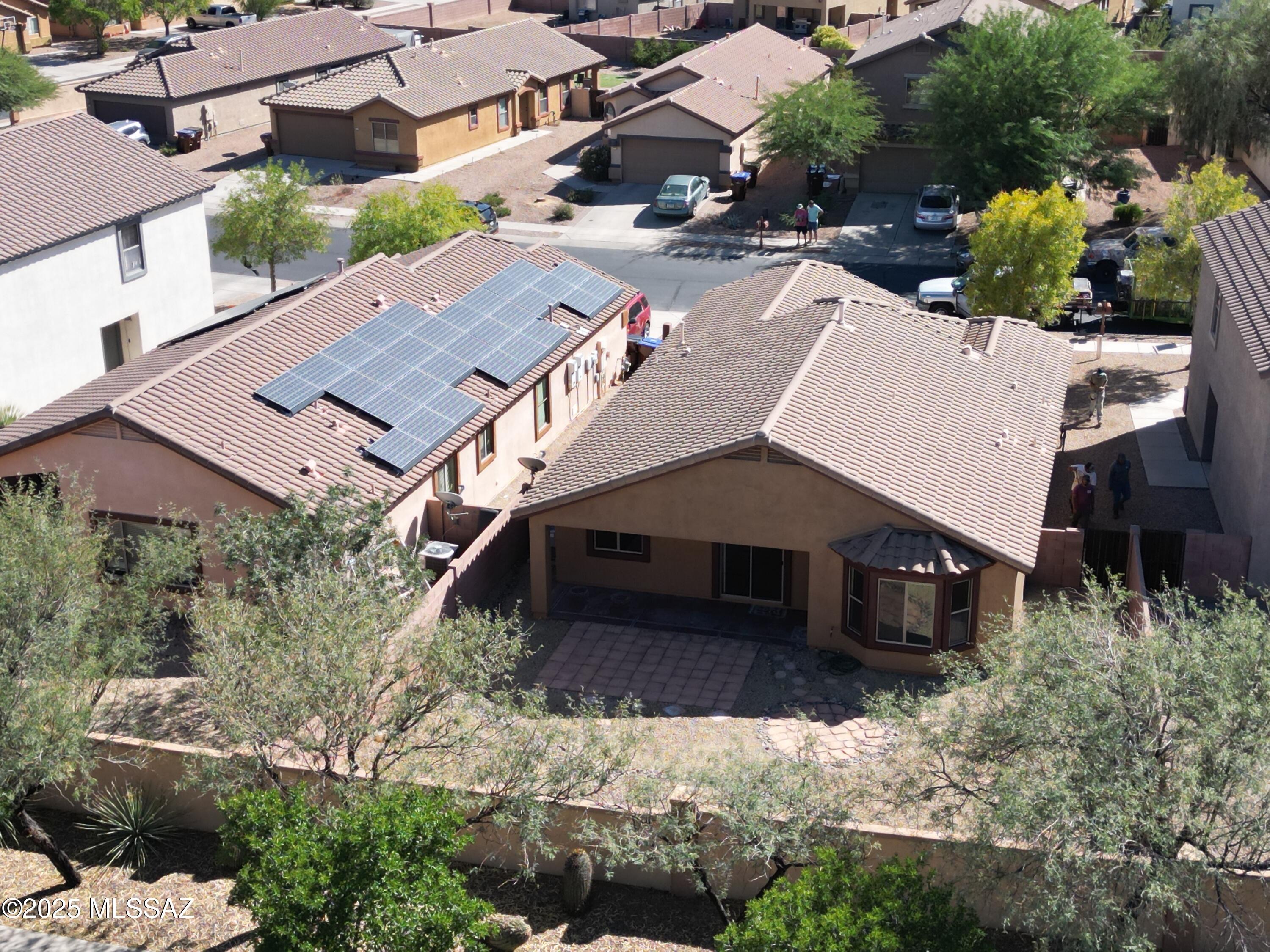 This beautiful 2-bedroom + DEN (easily converted to third bedroom), 2-bath home in sought-after Rancho Sahuarita blends comfort and convenience with resort-style living. Freshly painted inside and out, it features brand-new carpet in the bedrooms and durable tile throughout the main living areas. The open-concept kitchen offers ample cabinet space, a large pantry, and a natural flow into the great room--perfect for gatherings. The primary suite features dual vanities, a shower, and a walk-in closet. Step outside to the covered back patio, which faces north for constant shade and year-round enjoyment. Just blocks from the North satellite pool, park, and scenic walking paths.