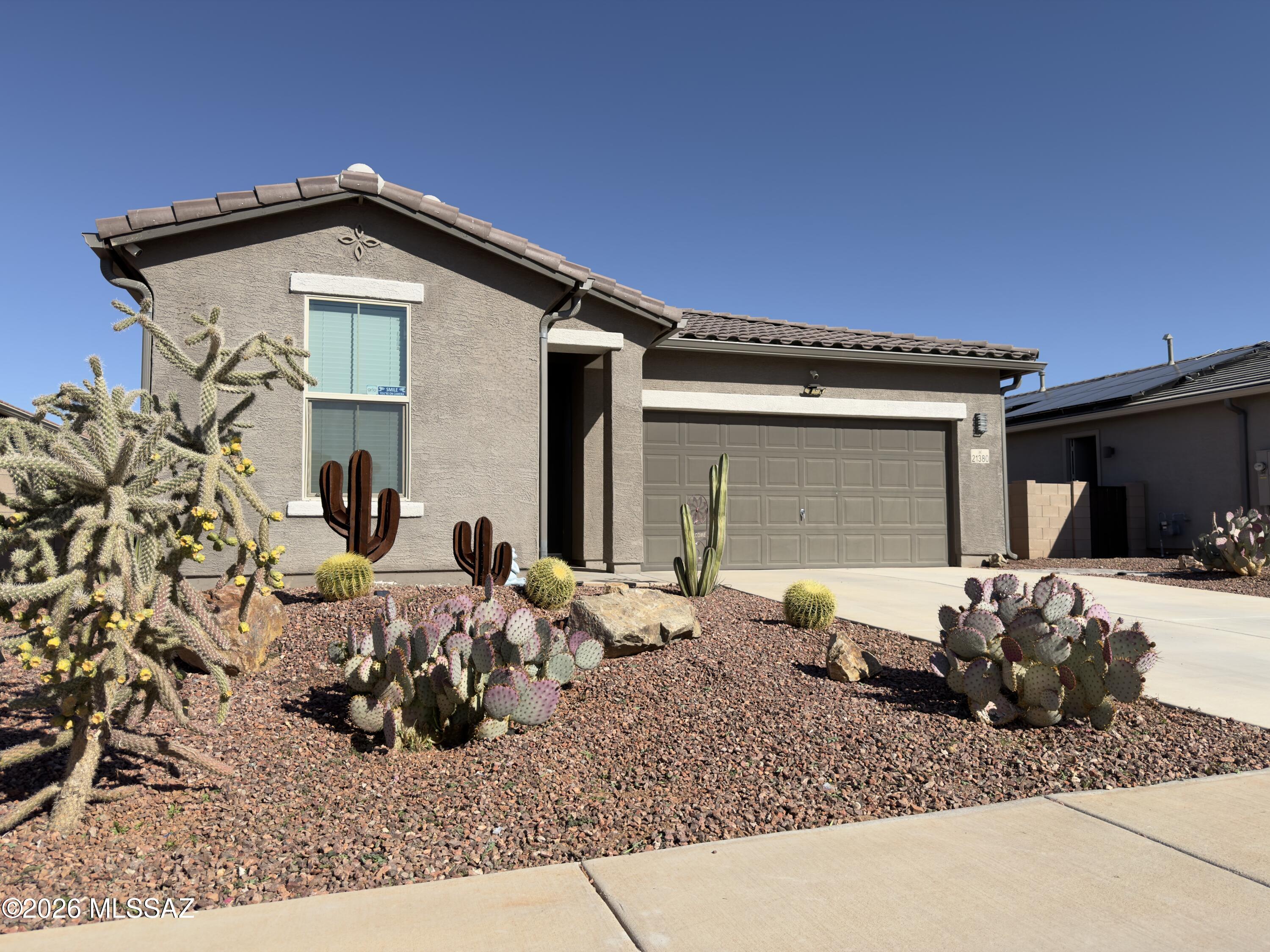 Welcome to this beautiful home in the desirable Red Rock Village community, offering 3 bedrooms, 2 bathrooms, a thoughtful design, and access to outstanding neighborhood amenities. This inviting home features an open‑concept layout with abundant natural light, a spacious great room, and a well appointed kitchen perfect for everyday living or entertaining. The split bedroom floor plan provides privacy, with a generous primary suite that includes a walking closet and an en suite bath. Step outside to a private backyard with plenty of room to relax under the gazebo. Whether you envision quiet evenings under the stars or weekend gatherings, this yard is ready for it. Residents of Red Rock Village enjoy access to parks, walking paths, a community pool, and a welcoming neighbor