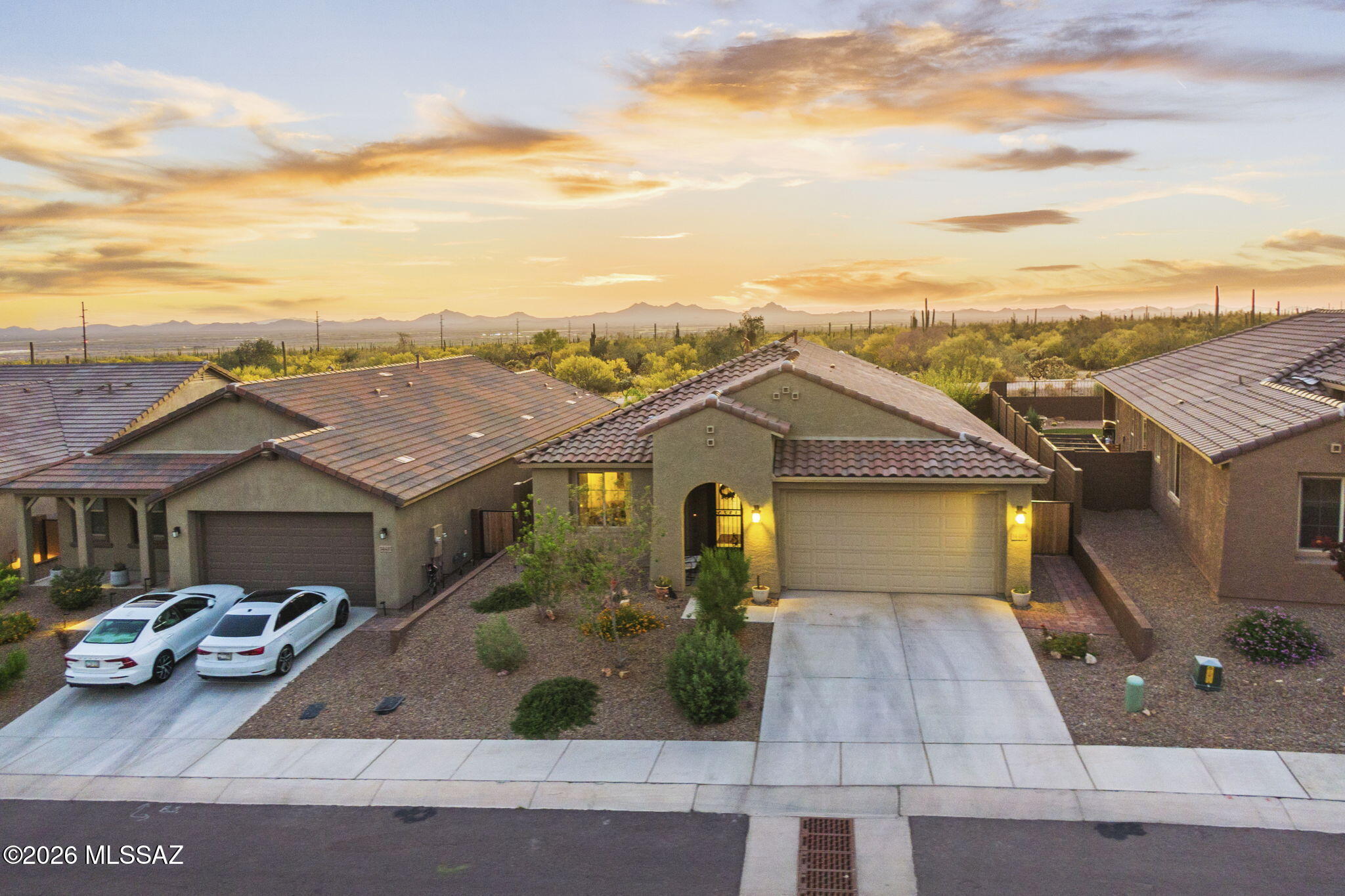 Like-new construction in the gated Saguaro Reserve at Dove Mountain, built in 2024 and set on a premium lot with no rear neighbors.

This highly sought-after Barletta floor plan by Pulte offers a clean, modern design with an open-concept layout ideal for both everyday living and entertaining. The kitchen features quartz countertops, stainless steel appliances, a gas range, custom cabinetry, and a large island that flows seamlessly into the main living space.

The split floor plan provides privacy, while the spacious den/flex room is perfect for a home office, media space, or additional living area.

The west-facing backyard captures beautiful Arizona sunsets and offers a private setting with no rear neighbors, complete with a covered patio, paver seating area, and spa perfect for relaxing or entertaining.

Located within walking distance to one of Dove Mountain's premier parks featuring pickleball, basketball, dog parks, a playground, and expansive green space. Dove Mountain also offers a highly regarded STEM school within the community, along with access to golf, hiking, and the scenic Tortolita Mountains.

A rare opportunity to own a newer construction home in one of Marana's most desirable communities, combining modern design, privacy, and an exceptional lifestyle.
