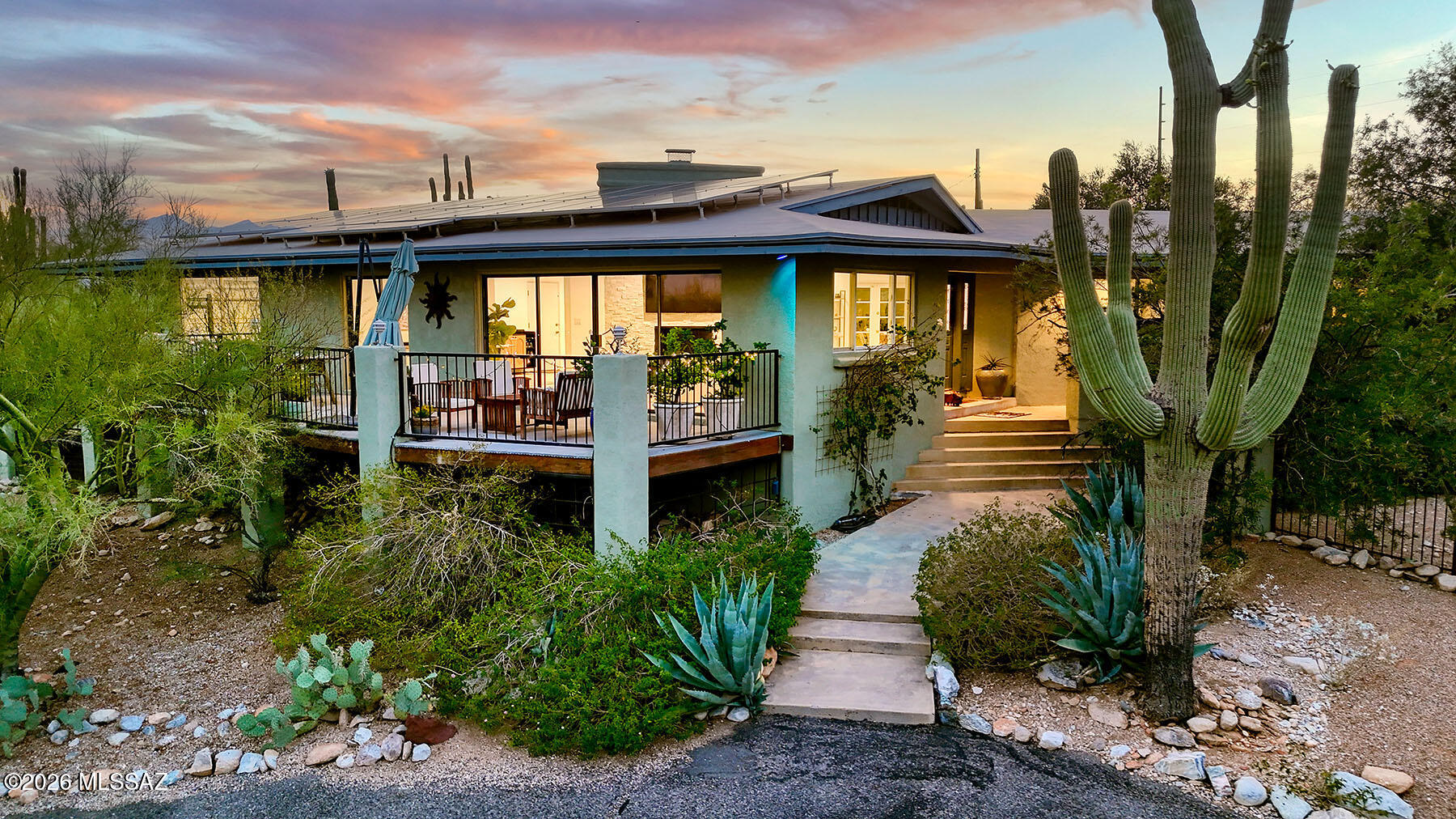 Set on a gorgeous 1-acre lot in Skyline Foothills Estates, this beautifully updated 3 bed/2.5 bath home offers exceptional indoor-outdoor living. Three distinct outdoor spaces include a sitting deck with city lights and mountain views, a resort-style backyard with a sparkling pool and newly designed outdoor kitchen for entertaining, and a front lawn with space for play or relaxing while taking in the views. Inside, the updated kitchen opens seamlessly to the gorgeous, light-filled living and dining areas, where expansive glass doors invite the outdoors in. The spacious primary suite conceals a private office behind a custom bookcase, creating a one-of-a-kind hidden retreat. A bonus climate-controlled storage room off the garage adds flexible space for hobbies or extra storage. Owned solar.