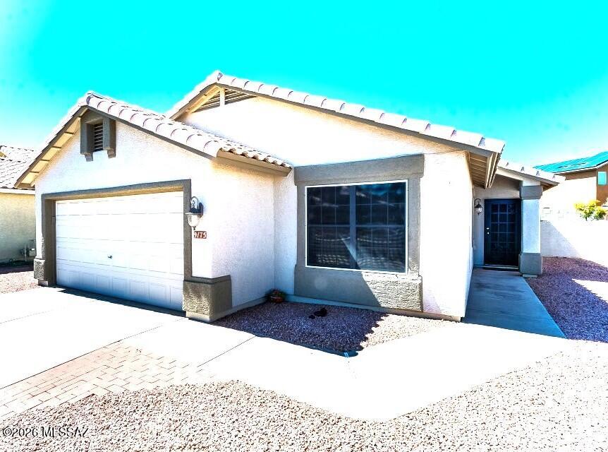 Updated Continental Ranch Stunner! Step into your great room with soaring ceilings, plantation shutters and engineered cherry wood floors. Chef's kitchen with an upgraded gas stove, granite countertops and a plethora of cabinets. Custom backsplash for ease of care! Architectural detail abounds with an open arch into the living space, plant shelves +! Lovely dining area off of kitchen. Plantation shutters throughout. Garage features storage, work bench, cabinets, finished floor AND a mini split AC!! The backyard oasis includes covered patio, generous use of hardscape, a water feature and low care landscaping! Won't last long. One or two pets with owner approval!