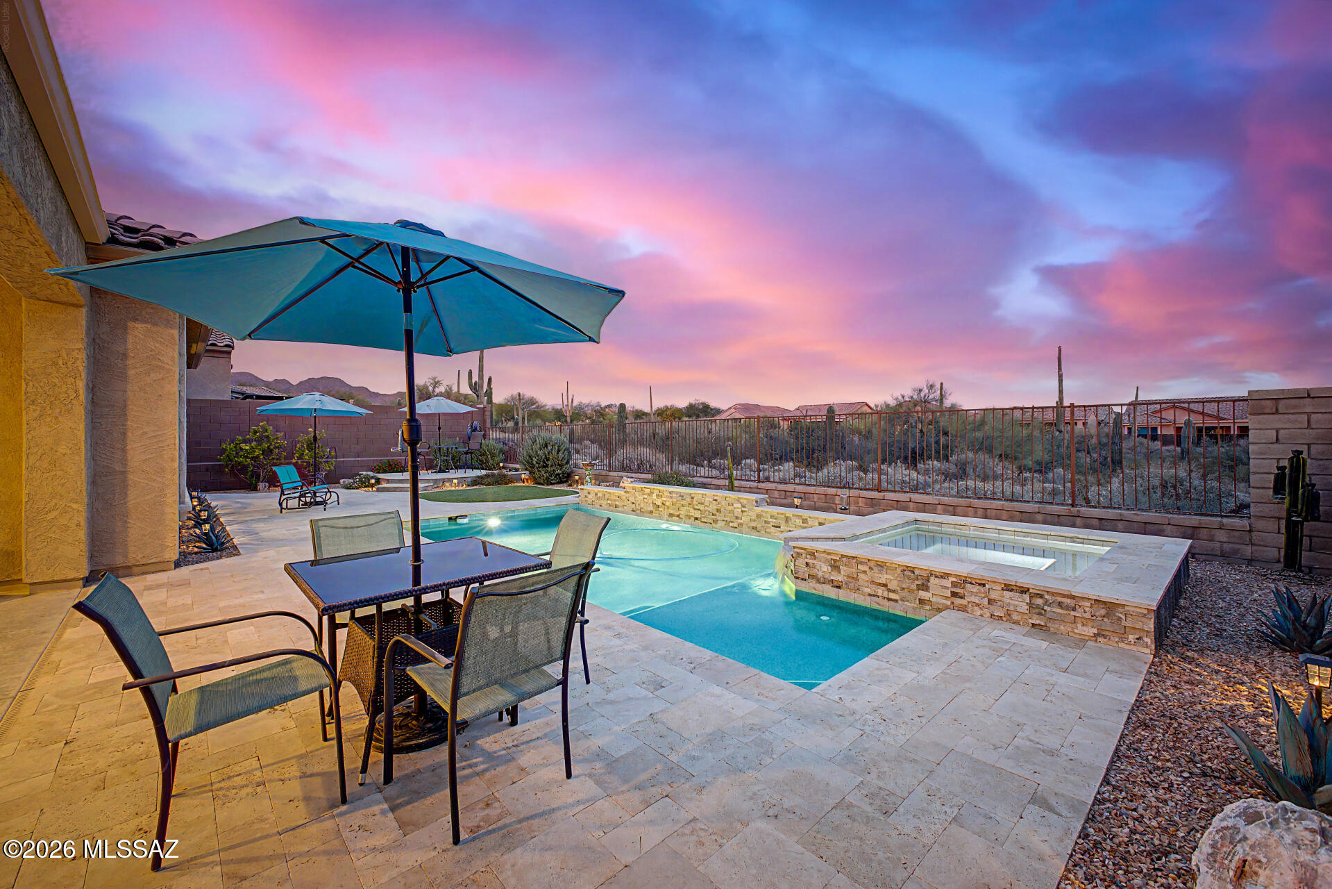 The search is over! Soak in stunning mountain views and breathtaking sunsets from your private backyard oasis, complete with a sparkling pool, relaxing spa, covered patio, and outdoor fireplace--perfect for entertaining or unwinding. This beautiful home also offers great curb appeal with a charming desert landscape and paver patio, where the mountain views can even be enjoyed from inside the home. Step inside to a captivating open layout featuring high ceilings, recessed lighting, a soothing palette, and attractive ceramic flooring throughout. The gourmet kitchen is a showstopper, boasting quartz countertops, crisp white cabinetry with crown moulding, chic pendant lighting, a mosaic tile backsplash, stainless steel appliances, a walk-in pantry, and a spacious island with a breakfast bar. This home offers incredible flexibility with two bonus rooms ideal for two offices, guest rooms, or creative studios perfect for today's lifestyle needs. The spacious primary suite features soft carpeting, a private ensuite with dual sinks, and a walk-in closet. Additional highlights include a large laundry room with abundant cabinetry for storage and an extended 2-car garage, providing extra space for vehicles, storage, or hobbies.

Make this stunning desert retreat yours!