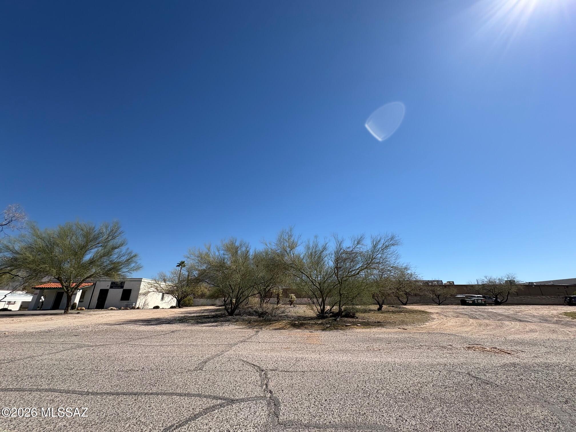 Rare opportunity to own the last available vacant lot in Wetmore Professional Plaza, located in central Tucson near Tucson mall, dining, and everyday amenities. This parcel offers electric and cable/internet on site with water and sewer available at the street for added convenience and lowered development costs. Zone for professional office use only per CC&R's, preserving the integrity of the plaza. Plans for an office suite are available, providing a valuable head start for development. Build-to-suit opportunity with financing options available. Ideal for business owners or investors seeking a strategic location with strong surrounding presence. Owner/agent.