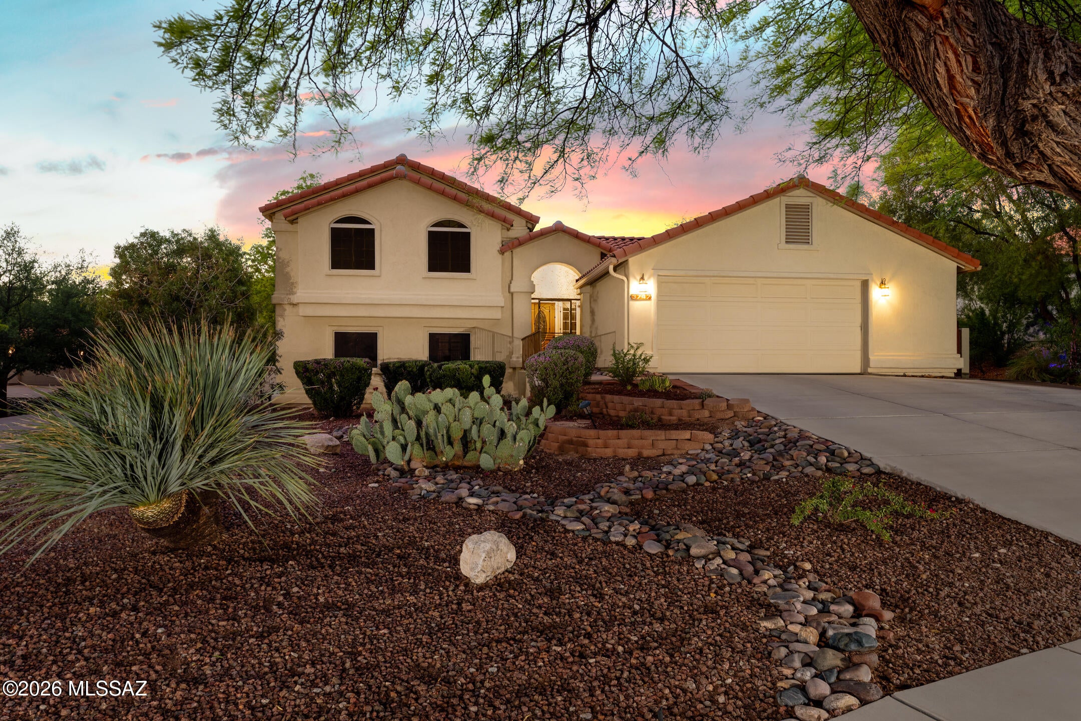 BACK ON THE MARKET! Beautifully updated 5-bedroom, 3-bath Multi-Level home on a spacious .45-acre lot with stunning mountain views.Enjoy the AZ lifestyle with a heated Pool and Spa, spacious backyard, balcony and multiple living areas.Updated kitchen features granite countertops, stunning waterfall island, stainless steel appliances, updated flooring, modern lighting, refreshed bathrooms. A second living area with custom bar creates the perfect space for entertaining.-With 2,463 sq ft of thoughtfully designed living space, this home blends modern updates with comfort and effortless indoor-outdoor living. Enjoy breathtaking mountain views and the best of Tucson lifestyle. An  opportunity to enjoy space, style, privacy and the best of Az living. Art Ornelas-Broker in Az, is related to seller