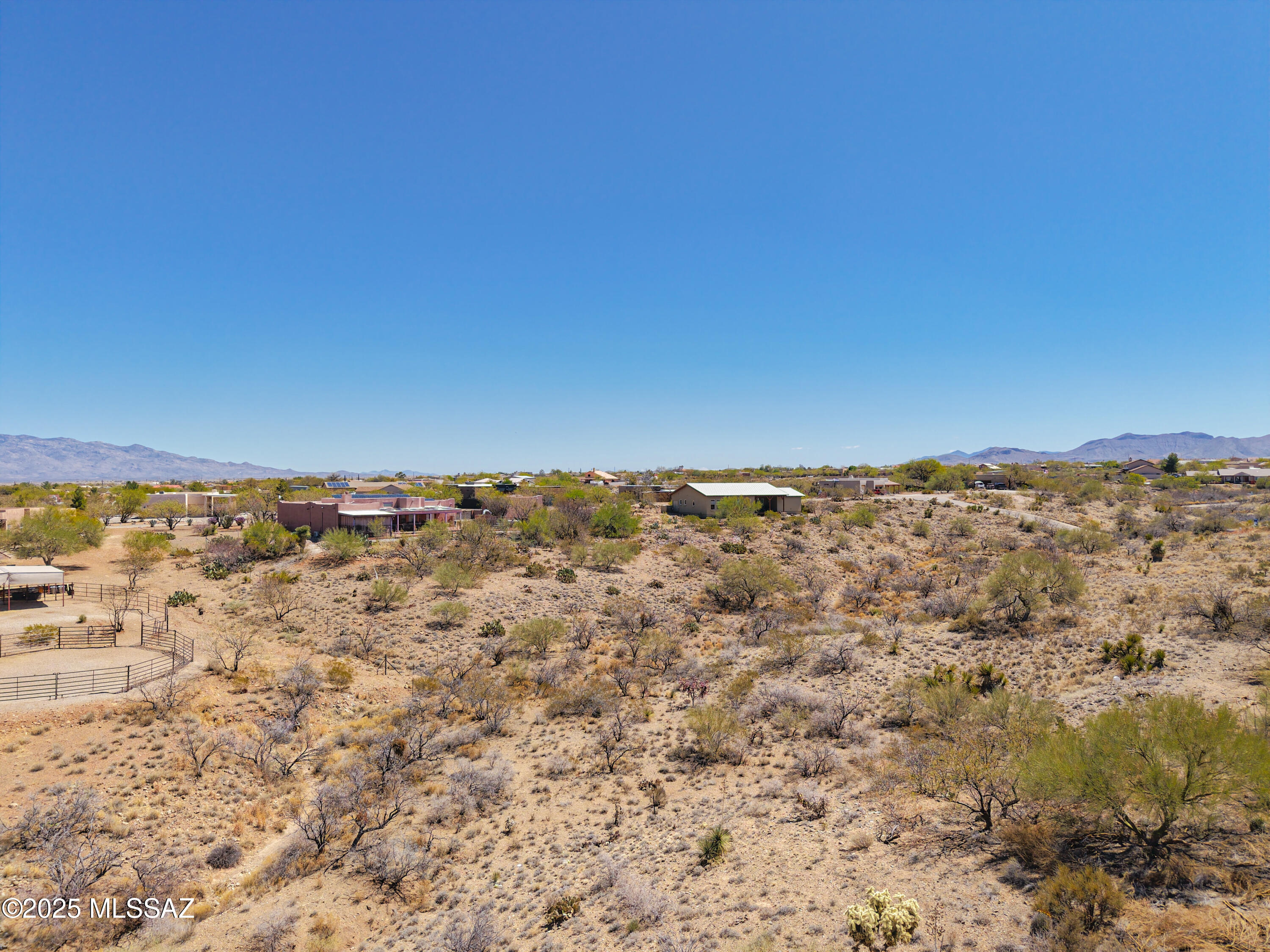 Take advantage of this large 1.68 acre lot that offers exceptional elbow room and build the home you've always dreamed about. Located in the New Tucson neighborhood, you'll find nearby home construction pointing to this area's desirability. Access this parcel via a longer  entry drive which opens onto a gradually descending slope. The terrain can easily be filled on the back side for a well positioned north/northeast backyard orientation. Priced attractively for its acreage, you don't want to miss this opportunity. Underground utilities (electric, water, and phone) are in place at the street. An adjoining 1.16 acre lot is also available for purchase.