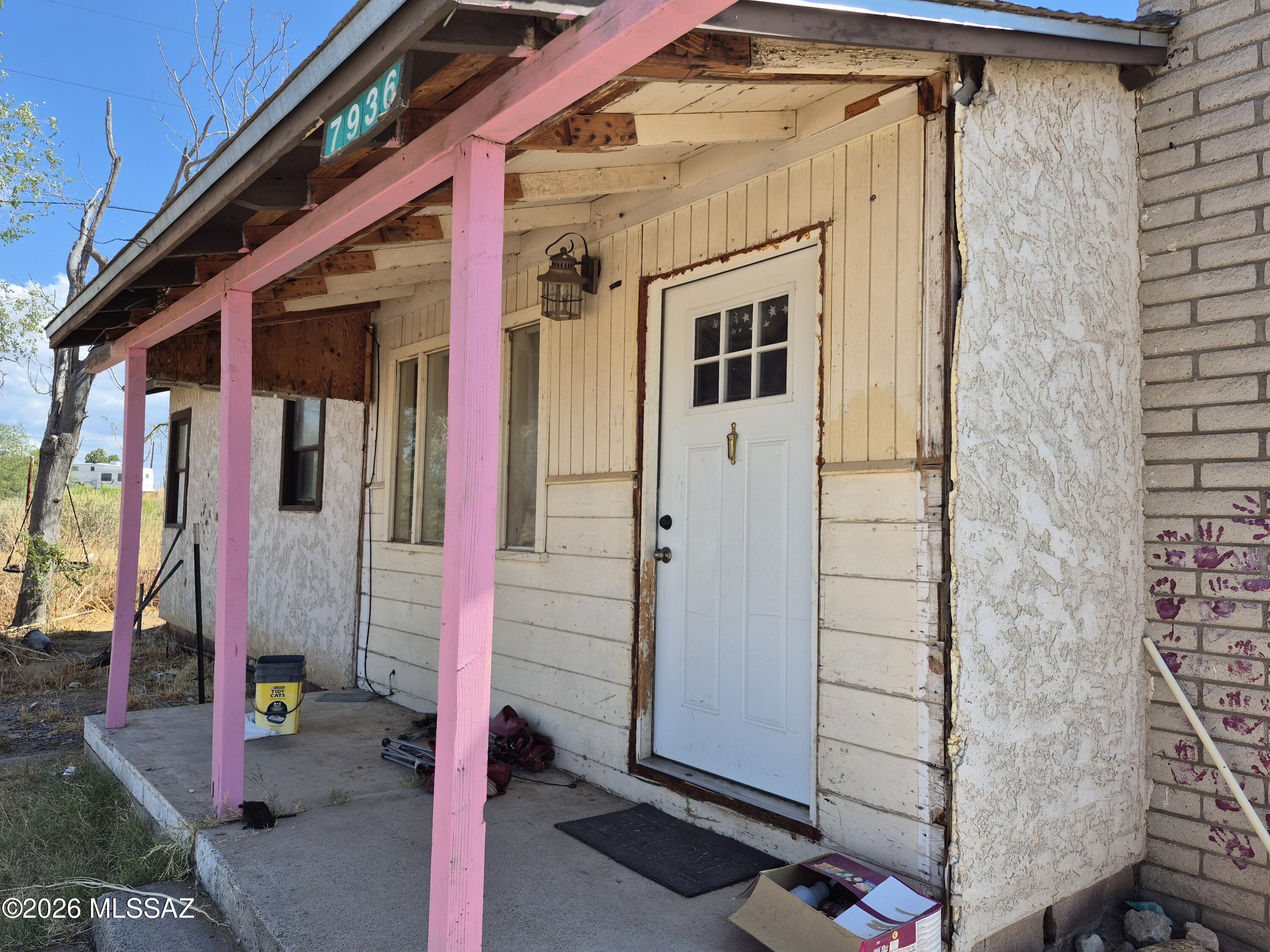 Fixer upper, investor special! 
Two parcels totaling 2 acres. Parcel 106-16-005 with the home and parcel 106-18-003D behind it. 
HVAC is only 4 years old. Water heater is 1 year old. Stainless steel fridge and gas range. 
Property is connected to water. There is also a well on the property but it was disconnected from the house, but still works. 
Roof replaced after the hail storm but needs some repair. Other structures are a chicken coop and a shed. Well is in the shed, shed needs repair. Property goes back beyond the back fence, through the wash. The house itself does not appear to be in the flood zone, buyer to verify. Being sold completely as-is.