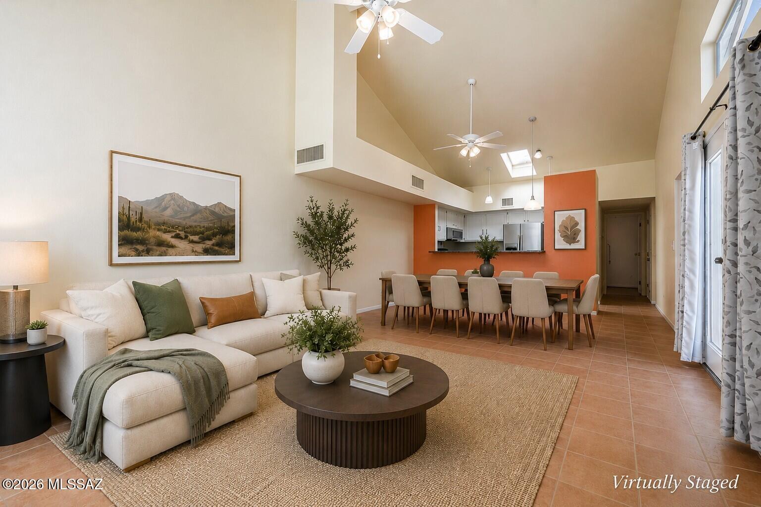 Welcome to easy, low-maintenance living in this spacious 2-bedroom, 2-bath townhome on Tucson's north side! Conveniently located just off Oracle Road, this home offers easy access to shopping, dining, and everyday conveniences. The open floor plan, large windows, and dual French doors create a bright and airy feel with an abundance of natural light. A sizeable den provides valuable flexibility and can easily serve as a third bedroom, home office, hobby room, or additional living space. The home features tile flooring throughout, granite countertops, stainless steel appliances, a charming built-in bench beneath the front window, and a walk-in closet in the primary bedroom. Step through the French doors to enjoy your private patio, perfect for relaxing or entertaining. Just steps from the community pool, this home also includes a 2-car garage with washer and dryer, plus a separate storage closet. The HOA adds to the ease of ownership by covering water, trash, front-yard maintenance, and the community pool. A wonderful combination of space, versatility, convenience, and low-maintenance Tucson living!