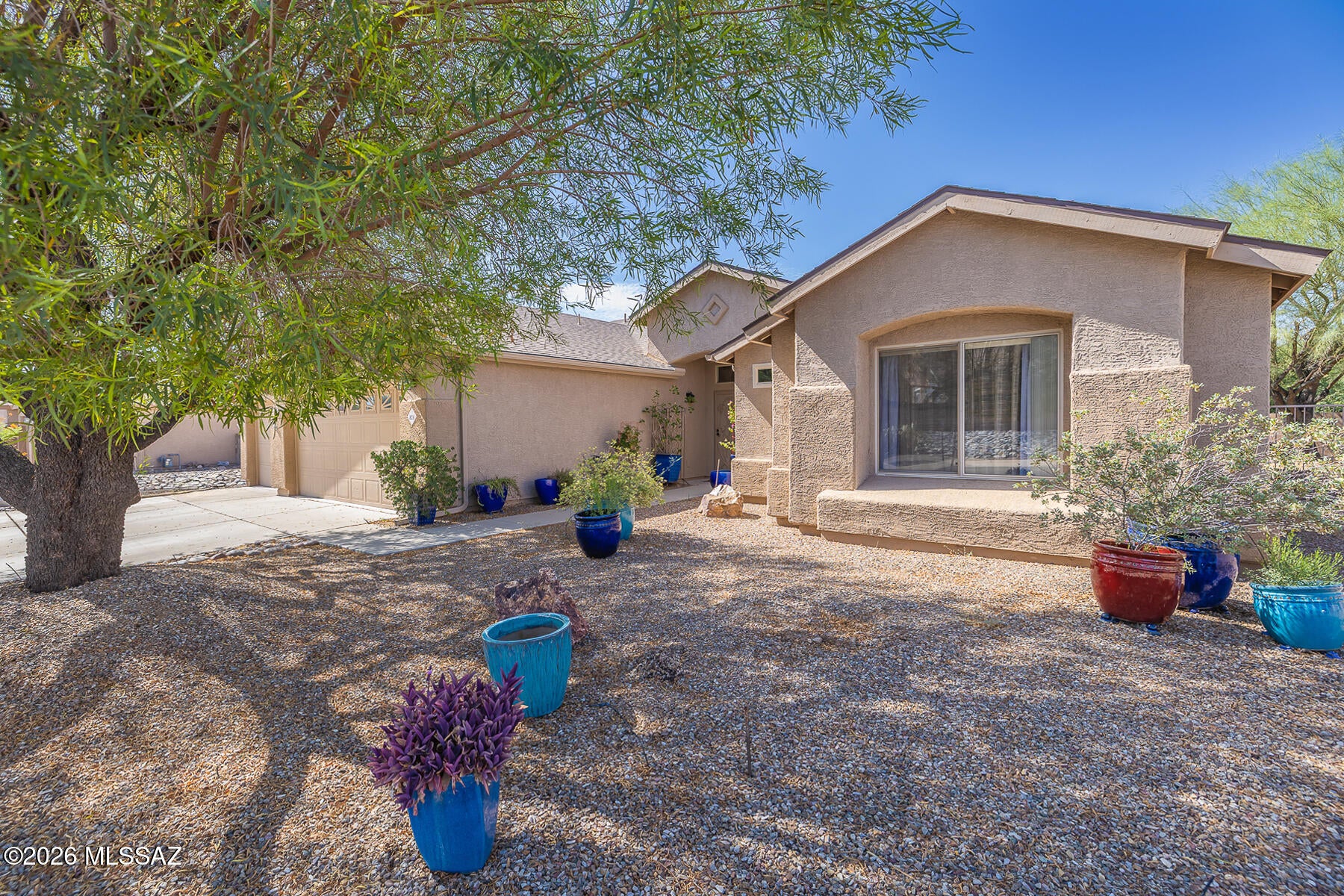 3BR + Den or poss. 4BR! Clean and ready to move into: Tile in main rooms of house!  Executive heigth countertop in MBR, panelled doors, ALL - newer (2023-2025) appliances convey incl. fridge, self cleaning stove and W/D, alarm system (ADT). Kit. w/upgraded Alder cabs.-teak finish w/pullouts in many of the cabinets, ''cookbook'' shelves, spice drawer, lighted pantry with adjustable shelves. Acrylic shower surrounds. Beautiful hardwired ceilings fans throughout. Office/den w/unique fan, desk area. Tankless water heater, reverse osmosis, plumbing/elec. for spa on patio. Solar screens, dbl gate to yard, patio w/fans, NO neighbors on 2 sides.