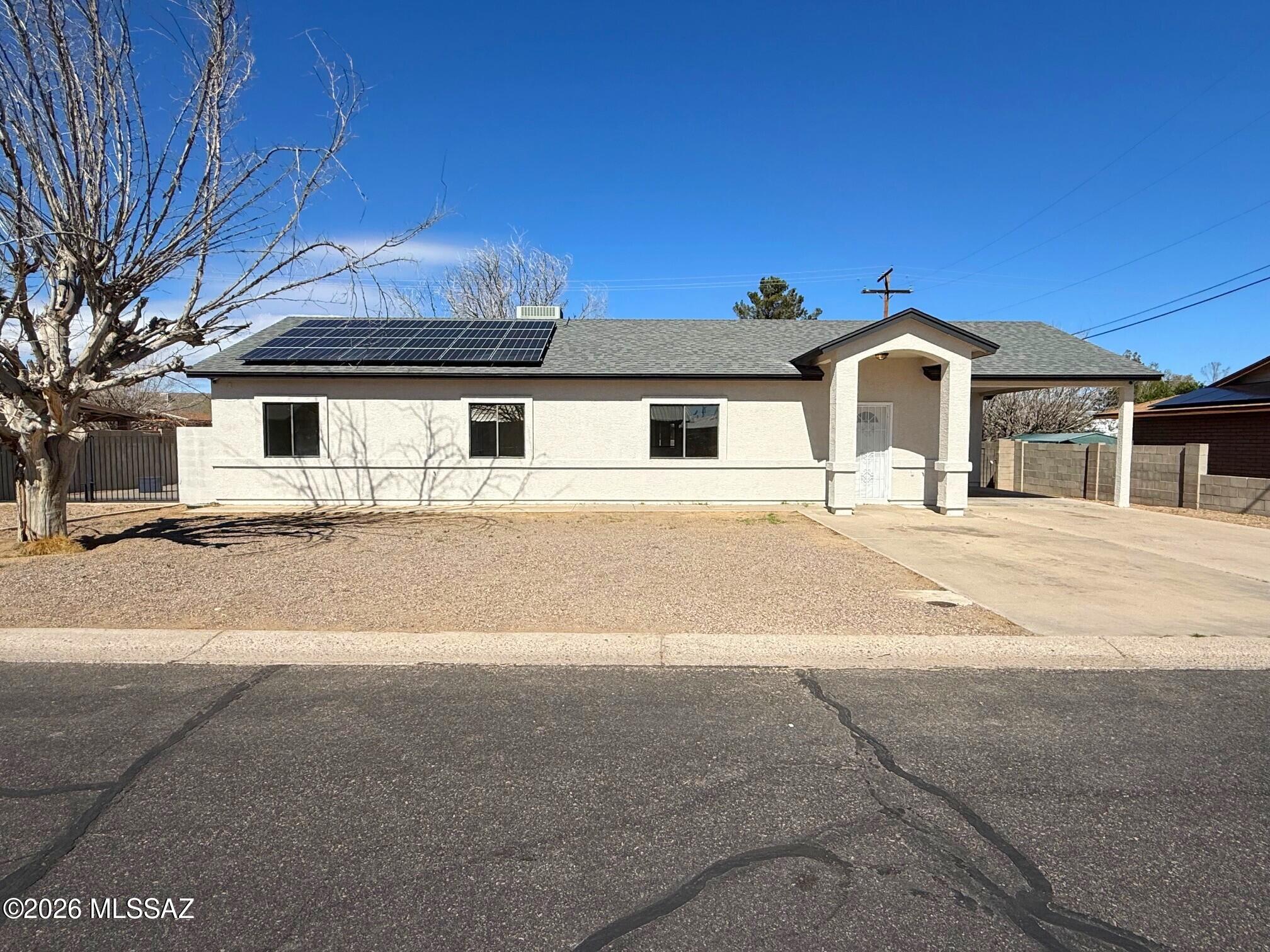 Spectacular in Safford! This bright and open 3 bed/2 bath home with a bonus room features ample natural light, new stainless steel appliances, striking tile in all the right places, new carpet in the bedrooms, and tasteful touches throughout. Outside, you'll find an expansive covered patio, large workshop/storage shed, and an RV gate with RV parking. All this and more in a friendly, quiet neighborhood. Welcome home!