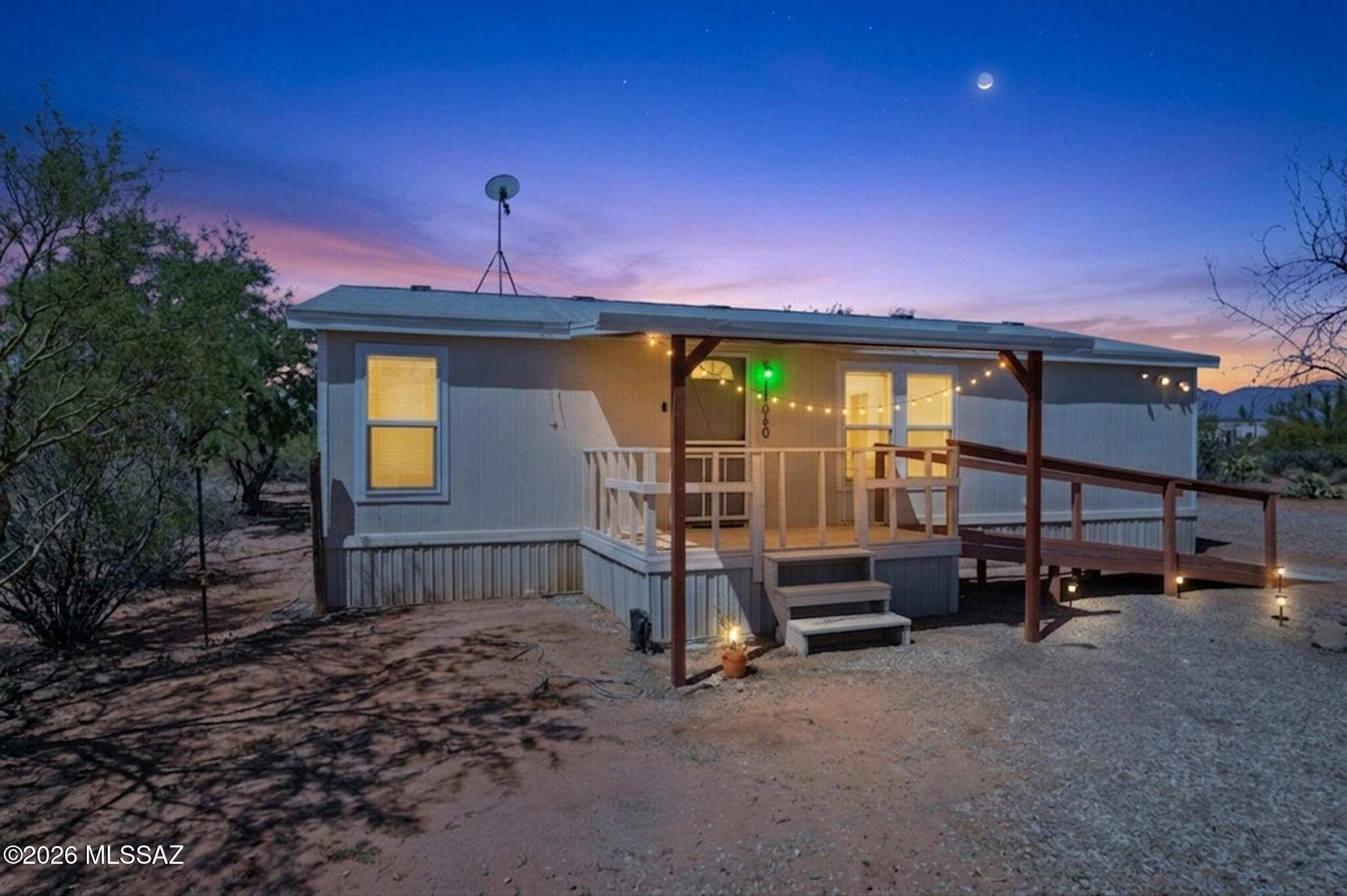 Nestled on a full acre with desert and sunset views, this well maintained 3-bedroom, 2-bath home offers the perfect blend of space, and Arizona living with no HOA restrictions. Only .4 miles to Roadrunner Elementary. Featuring 1,232 square feet of bright and open living space, the split-bedroom floor plan provides privacy and functionality while vaulted ceilings and natural light create an inviting atmosphere. The kitchen offers extensive cabinetry, generous counter space, ideal for entertaining or everyday living. The primary suite features a walk-in closet and bathroom, while the additional bedrooms provide flexibility for guests, or a home office. The property also includes an RV hookup, ample parking, and two storage sheds for added convenience. Step outside and enjoy the best of desert living with a covered deck, fenced backyard, mature desert landscaping, and endless room for RVs, trailers, toys, horses, or future additions. Surrounded by desert views, this property delivers peaceful country-style living while still offering accessibility to the city. Take the opportunity to own an acre property with space, freedom, and incredible Arizona sunsets.