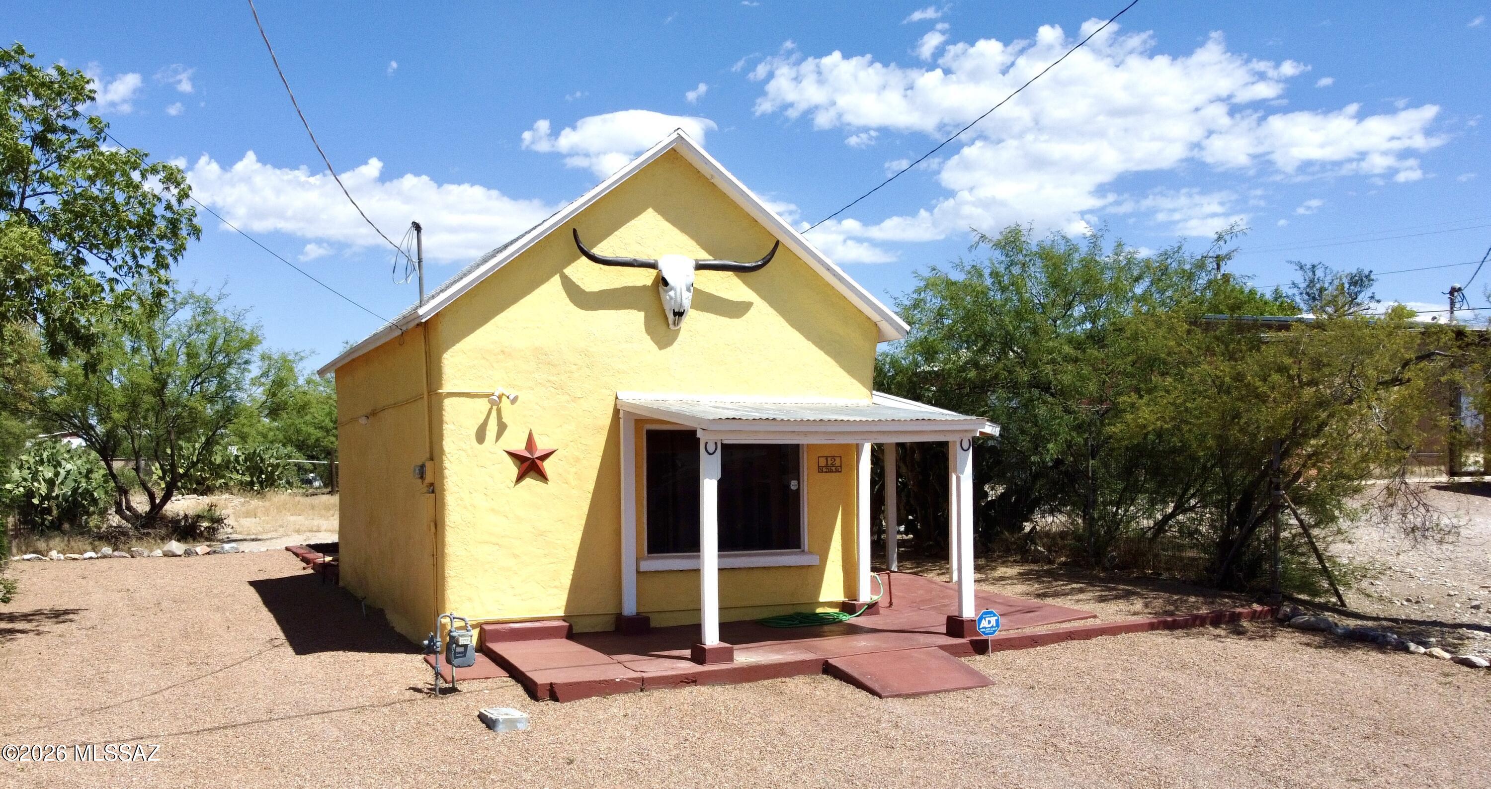 Welcome to this newly remodeled, turn-key Adobe home in the heart of Tombstone, Arizona! Full of charm and character, this adorable 2-bedroom, 1-bath residence offers the perfect blend of historic appeal and modern comfort. Ideally located within walking distance of Historic Allen Street, local shops, restaurants, and popular attractions, you'll enjoy all the conveniences and excitement that Tombstone has to offer.
Step inside to find a spacious living area filled with natural light, creating a warm and inviting atmosphere. The bright kitchen features attractive tile countertops and ample space for meal preparation and entertaining. Both bedrooms offer comfortable accommodations, making this home ideal as a primary residence, winter retreat, or investment property. Situated on a large, fully fenced lot, the property provides plenty of room for outdoor enjoyment, pets, or future enhancements. A convenient storage room located at the rear of the home offers additional space for tools, seasonal items, or hobby equipment.

Whether you're looking for a successful short-term rental opportunity, a cozy snowbird getaway, or a charming place to call home, this move-in-ready Tombstone gem is a must-see!