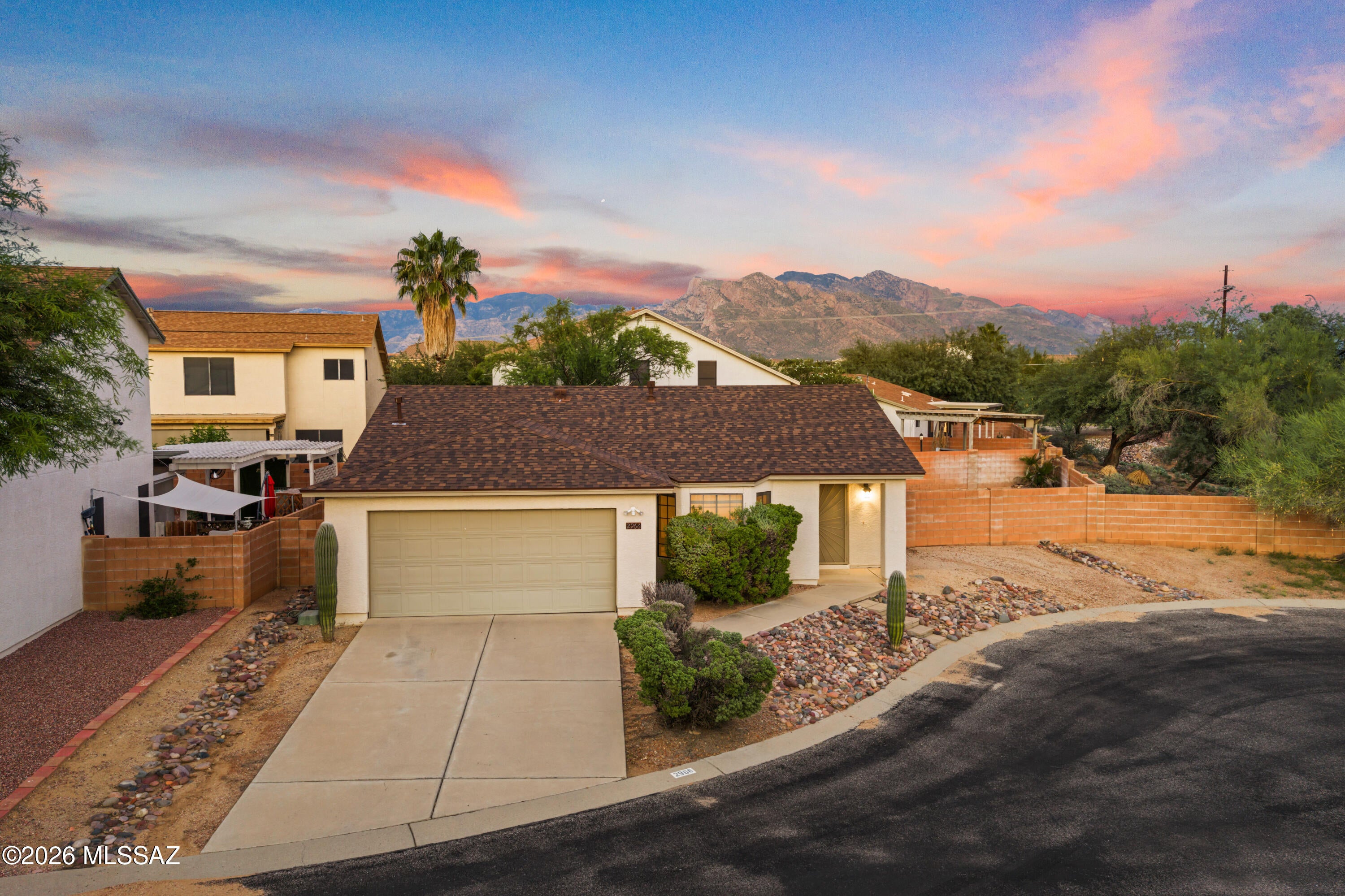 Set on an oversized cul-de-sac lot with Catalina Mountain views, this single-level home offers convenience, comfort, and long-term value in one of Northwest Tucson's most accessible locations.

The neighborhood puts daily needs and weekend plans close to home. The Omni Tucson National Resort is minutes away, with championship golf, spa services, and dining. Uptown offers a growing mix of restaurants, coffee shops, and retail, and Tucson Mall, grocery stores, and everyday services are a short drive away. Outdoor enthusiasts can enjoy The Loop's multi-use paths, Tohono Chul's desert gardens, and the trails of Catalina State Park and the Santa Catalina foothills. Quick access to I-10 and major corridors makes commuting to downtown, the University of Arizona, Marana, and Phoenix simple. The interior features vaulted ceilings, abundant natural light, and tile flooring throughout. The updated kitchen includes two-tone painted cabinetry, light quartz-style countertops, an undermount sink with pull-down faucet, and stainless steel appliances with a gas range. The adjacent dining area opens through a sliding door to the covered rear patio.

The primary suite includes a walk-in closet, dual-sink vanity, private water closet, and tub/shower combination. Secondary bedrooms offer generous natural light, including a bay window, and are served by a full guest bath.

The fully block-walled backyard provides low-maintenance desert landscaping, a covered patio, and ample side yard space with room for future improvements such as a pool or outdoor living area. Additional features include a two-car garage and drought-tolerant front landscaping.

Vacant and move-in ready, the property is a strong opportunity for owner-occupants and investors alike. Durable finishes, minimal exterior upkeep, and proximity to employment centers, resort amenities, shopping, recreation, and freeway access support consistent rental demand and long-term appreciation.