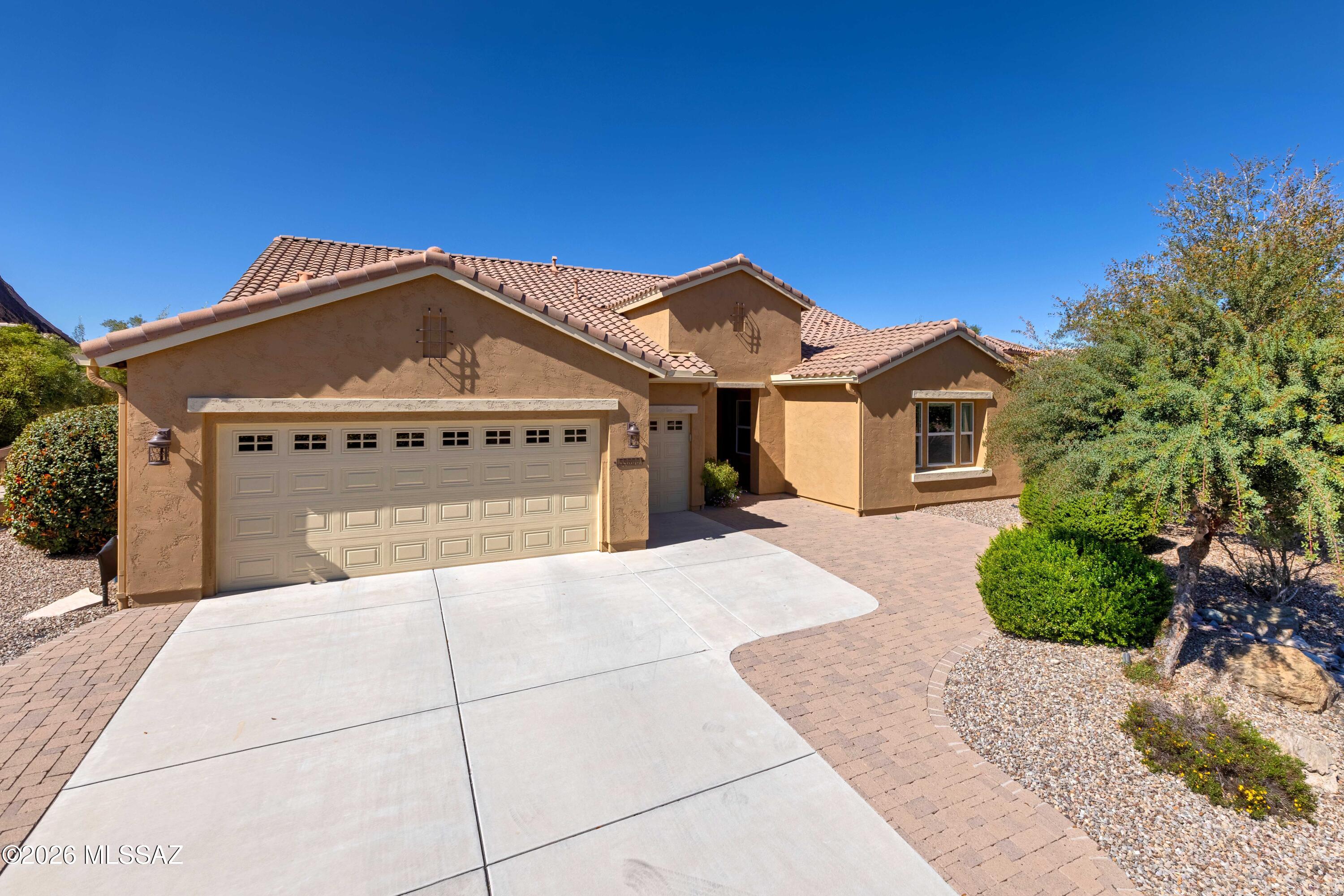 Golf Course Living on the 16th Fairway | Rare 2,500+ Sq Ft Pima Model Near Clubhouse
Golf course living at its finest. This beautifully upgraded home is located on the 16th fairway near the green in Robson's premier 55+ active adult community of SaddleBrooke Ranch, offering stunning views and a prime location just moments from the Ranch's exceptional amenities including the clubhouse, indoor and outdoor pools, fitness center, driving range, putting greens, restaurants, and social clubs.

This sought-after Pima floor plan offers over 2,500 square feet of thoughtfully designed living space, featuring two spacious bedrooms, a den, two full bathrooms, and a powder bath. The Pima is one of the community's most popular layouts and is no longer offered by the builder, making this home a unique opportunity within SaddleBrooke Ranch.

A welcoming entry begins with a custom front door, opening to a light-filled interior showcasing upgraded cabinetry, built-ins throughout, surround sound, and a security system. The well-appointed kitchen is ideal for both daily living and entertaining and features upgraded appliances including a built-in refrigerator, dual ovens, and a warming drawer.

The spacious primary suite features a bay window and private access to the patio, creating a peaceful retreat overlooking the outdoor living space and golf course beyond. The guest suite includes a custom four-foot extension and a private ensuite bath, providing additional comfort and privacy for visitors. A cozy den with an electric fireplace offers a flexible space for a home office, media room, or quiet reading retreat.

Outdoor living is designed to take full advantage of the golf course setting with paver hardscaping, a patio fireplace, rolling shades, and a barbecue gas stub, creating a wonderful space for entertaining or relaxing while enjoying the fairway views.

Additional upgrades include custom closet storage systems in both bedrooms and the garage, epoxy garage flooring, a four-foot garage extension, an extended driveway, and a mini-split system in the garage for added comfort. The home also features a custom laundry room with a built-in office workspace along with numerous electrical upgrades including a convenient floor outlet.

This beautifully upgraded golf course residence combines location, space, and thoughtful upgrades, offering an exceptional opportunity to enjoy the SaddleBrooke Ranch lifestyle in one of the community's most desirable locations.