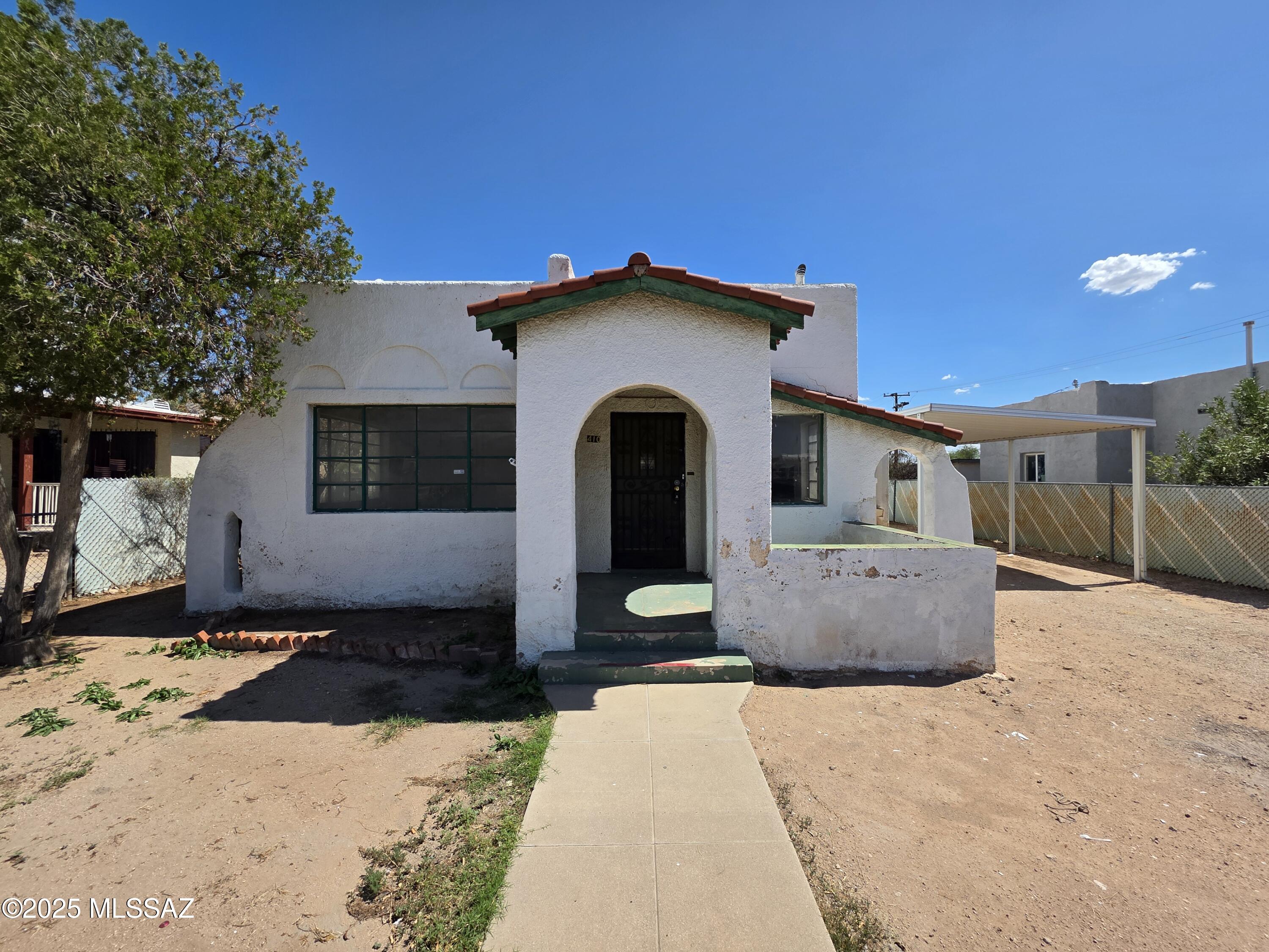 Great opportunity to own a HUD Home, save thousands! Masonry stucco home with views of A-Mountain from the backyard! Located across from Santa Rita Park, now undergoing exciting improvements. Inside, enjoy coved ceilings in the living and dining rooms, a cozy brick surround gas fireplace, and a spacious Arizona room with storage. West-side bedroom has a private entrance making it ideal for guest quarters. Huge backyard with a rear rolling gate entrance offers great potential in a central location! Please see attached MLS Addenda for property specific disclosures & repairs. Bidding on a HUD Home is quick & easy! Buyers or agents please call for help with any part of the bidding process.