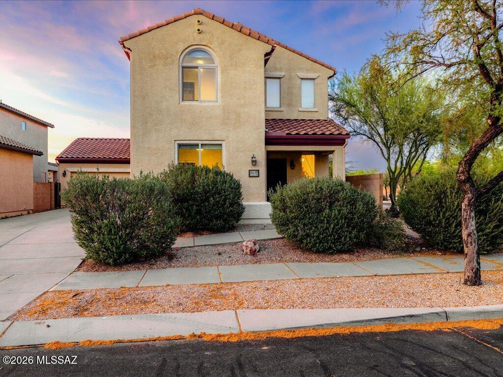 Beautiful two-story home, fully upgraded with all the bells and whistles! This 4-bedroom, 3-bath home sits on a desirable corner lot with ample guest parking and a 2-car garage. Enjoy mountain views from the spacious, beautifully landscaped backyard. The open great room features a stunning kitchen with stainless steel appliances, granite countertops, and upgraded cabinetry, flowing seamlessly into the dining and living areas. First-floor guest bedroom with full bath. Elegant staircase, upstairs laundry, and a spacious primary suite with a luxurious bath, large shower, double sinks, and XXL walk-in closet. Plus two additional bedrooms and a full bath. Amazing community pool and clubhouse. Near DMAFB and top-rated school!